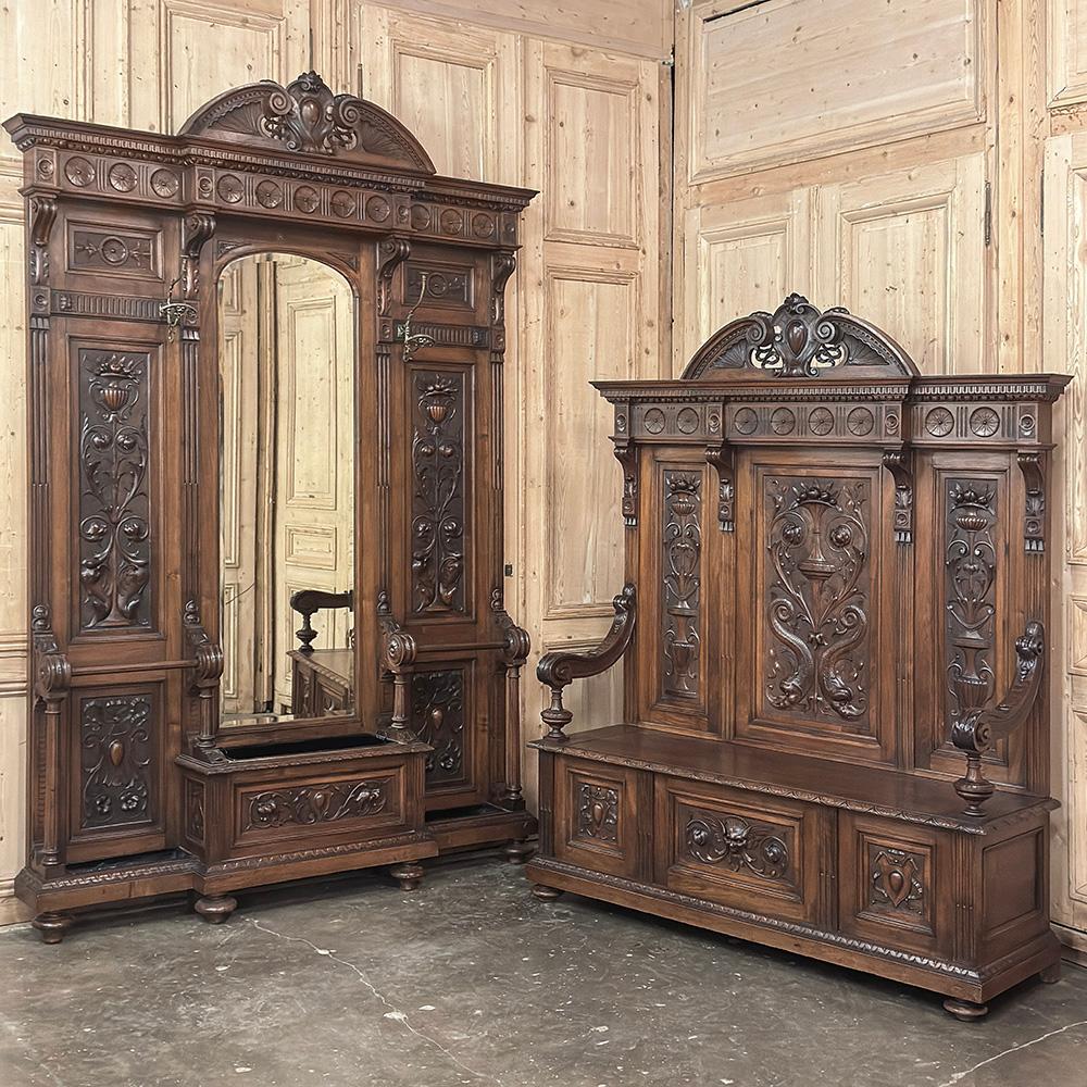 19th Century Grand Italian Hand-Carved Walnut Hall Tree is a glorious representation of the revival of the Renaissance style that occurred during the waning years of the 1800s.  Crafted from richly hued Italian walnut, it features a rectilinear,