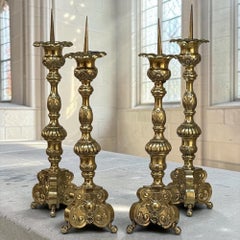 Set of FOUR Late 17th Century French Renaissance Brass Altar Candlesticks