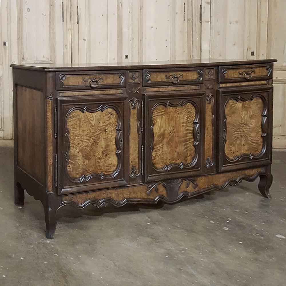 In the trademark style of the region of Bresse, the talented artisans of that area produced such interesting works as this 19th century Country French buffet/sideboard, created by hand-crafting a frame of enfilade from local indigenous fruitwood in