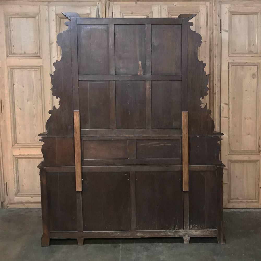 19th century French oak hunt two-tiered buffet - bookcase is the perfect choice for the masculine decor, with elaborate hand-carved detail from the crown to the base! Sculpted from old-growth oak to last for centuries, it features motifs such as the
