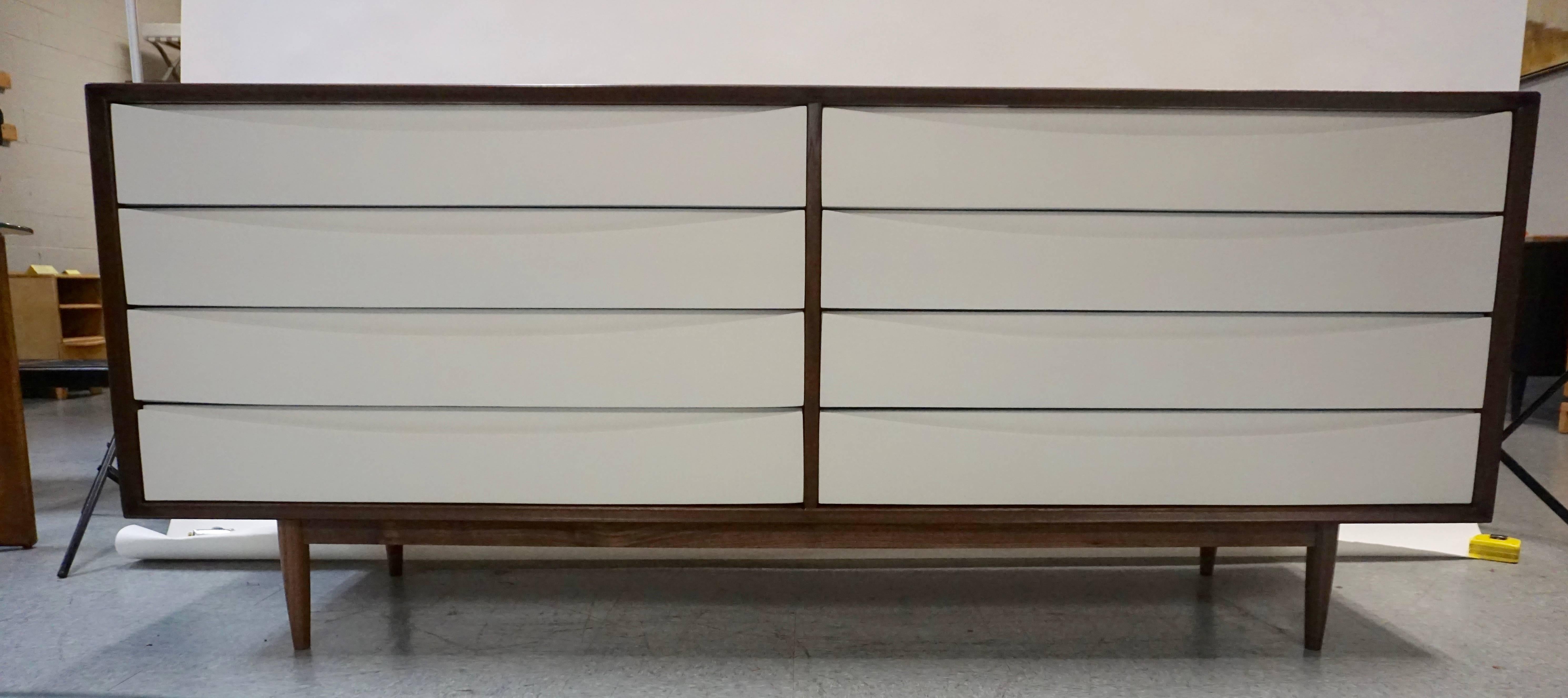 By Sibast Furniture, designed by Arne Vodder. Labeled. Restored. New, flat white lacquered drawer fronts. Finished back. Great condition.