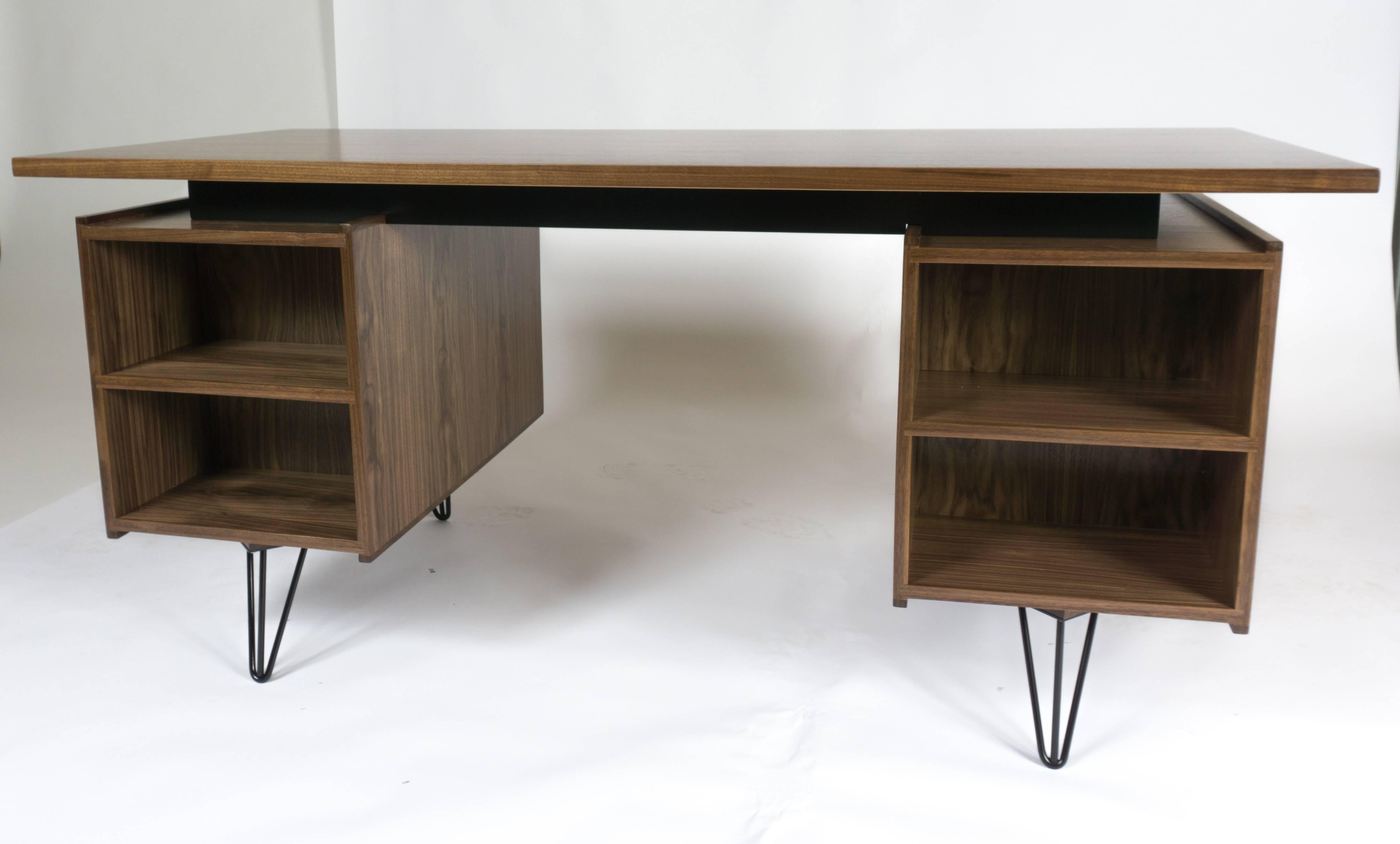 Designed and made by Precision Design and Neven & Neven Modern. One side has the two drawers and a pull-out writing board. Behind the left side door is a pull-out hanging file. On the other side of desk are open shelves to accommodate a variety
