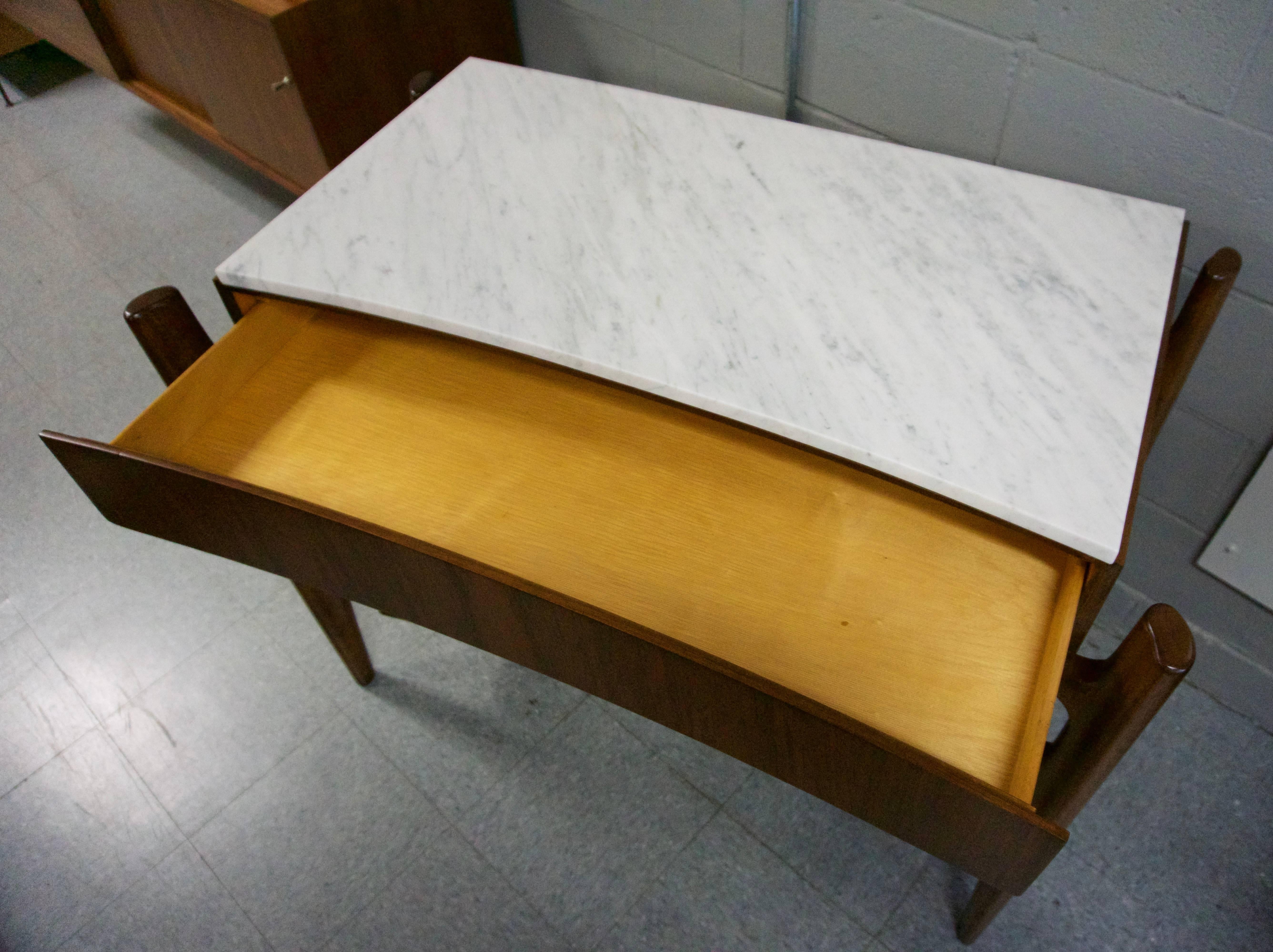 Great four-drawer dresser that has been restored inside and outside. New marble top. Marked with Sweden on back.