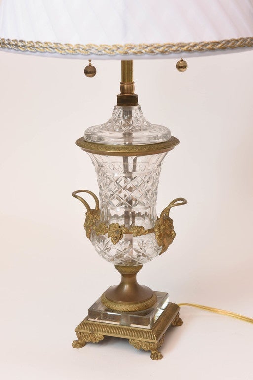 A pair of French bronze mounted compana shaped cut glass vases with masked handles, circa 1860