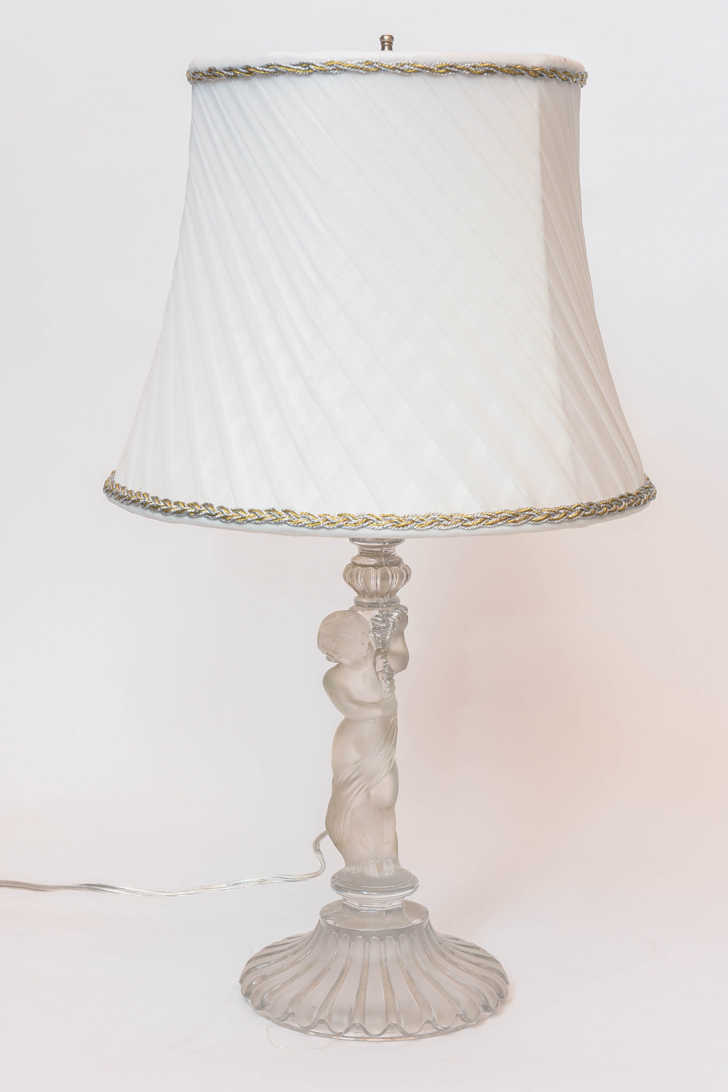 Pair of Baccarat Crystal Frosted Base Cupids Holding a Candlestick