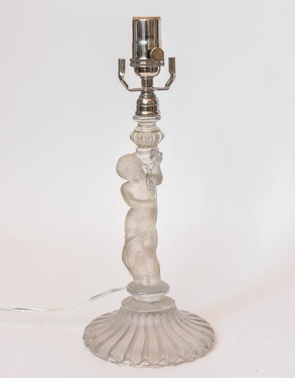 Pair of Baccarat Crystal Frosted Base Cupids Holding a Candlestick In Good Condition In Palm Beach, FL