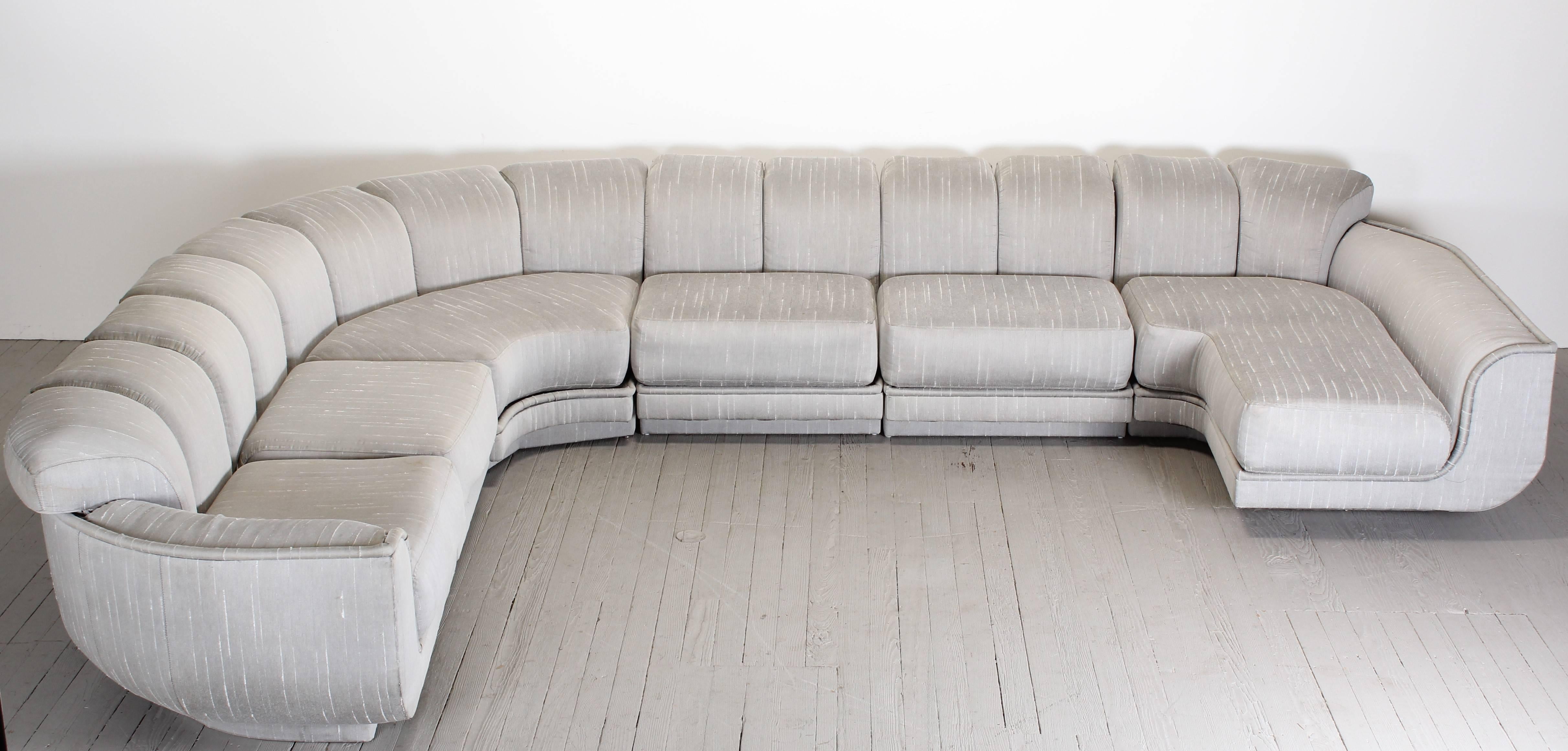 A magnificent and large-scale Milo Baughman style sectional sofa for Maurice Villency. Having wonderful exaggerated form. The sectional cushions are reminiscent of De Sede's non stop sofa. It would work well in any contemporary or traditional
