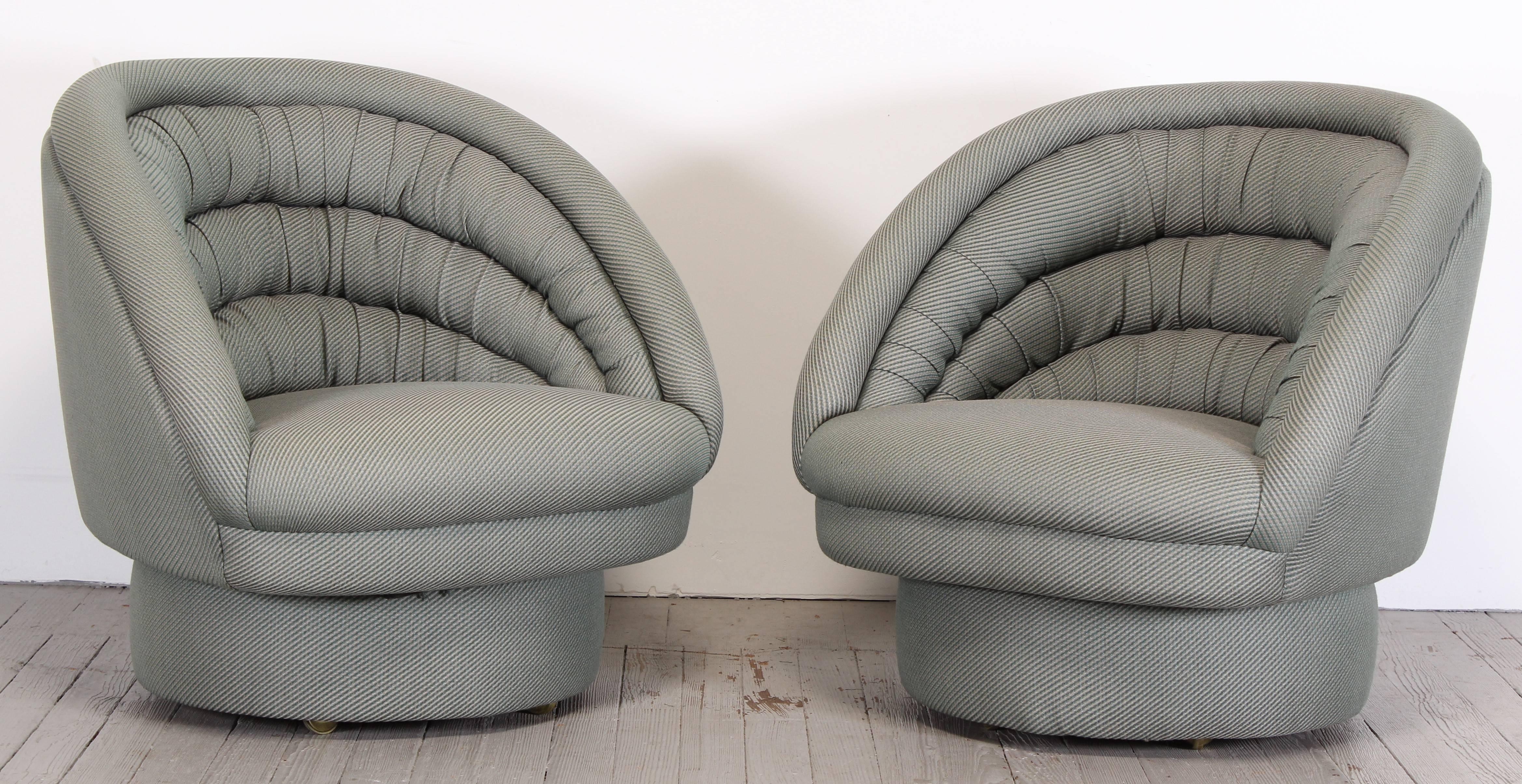 Pair of "Crescent" swivel and rolling chairs designed by Vladimir Kagan.
Chairs are structurally sound, fabric is approximately 15 years old and in very good condition.