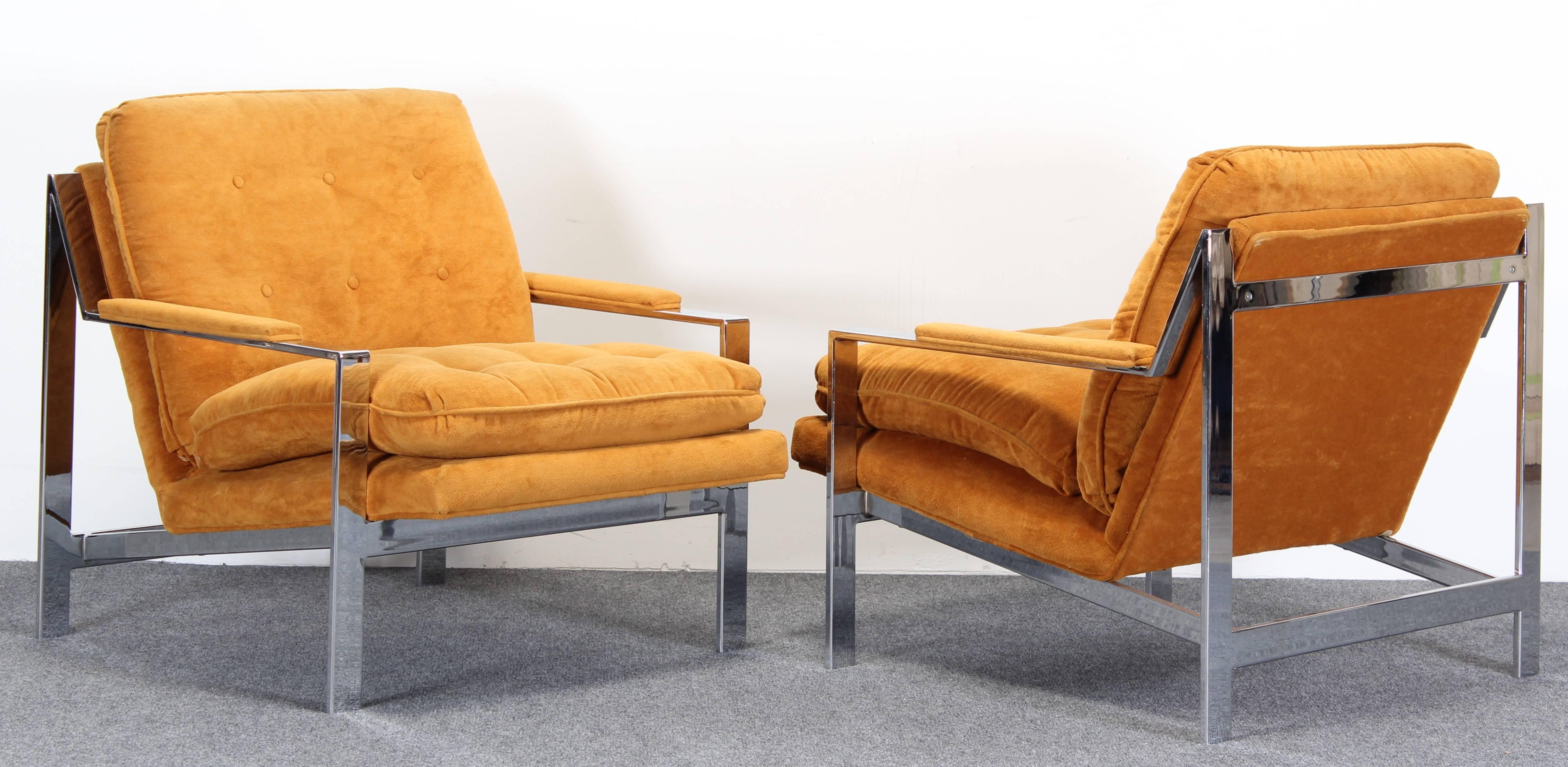 A great pair of chrome lounge chairs designed by Cy Mann. Chrome is in very good vintage condition as well as the original fabric. Some minor wear to corners on backs of chairs as shown in images. 