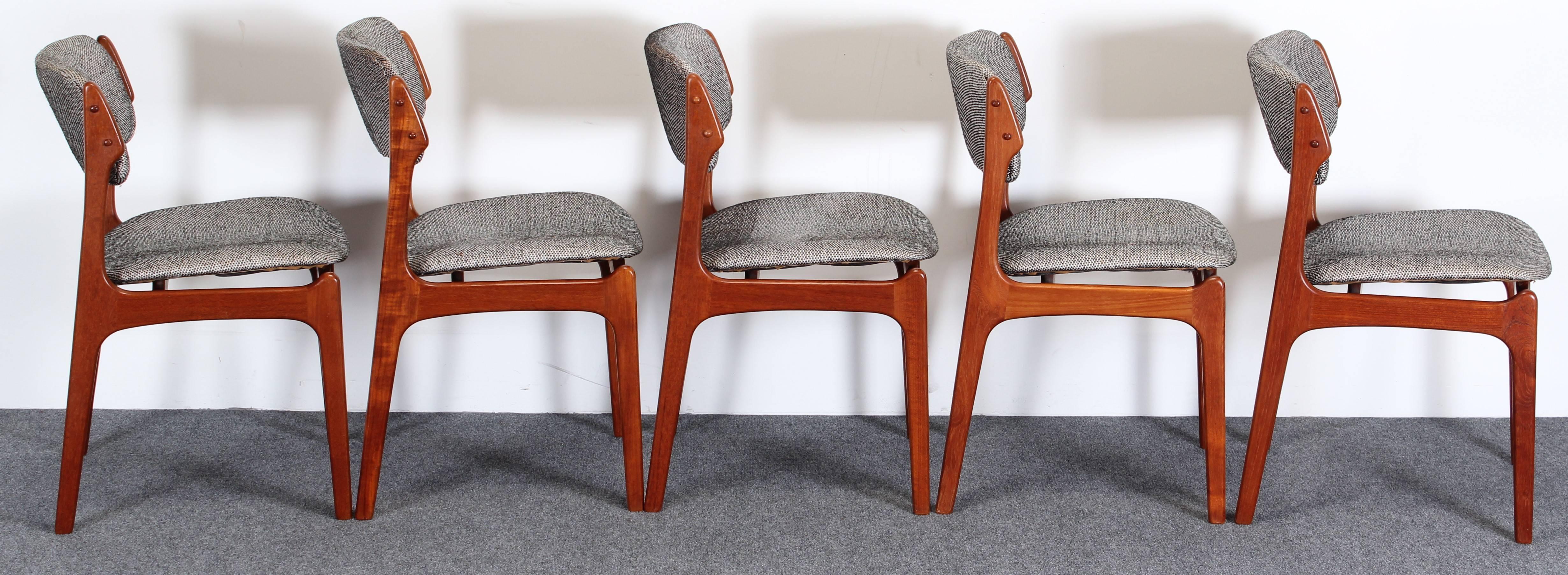 A sculptural set of five dining chairs by Model 49 by Erik Buch for Oddense Maskinsnedkeri. New upholstery needed. Wood has very nice grain. A couple of back rests are loose which can be modified at time of new upholstery. Seat width is 18.5 inches