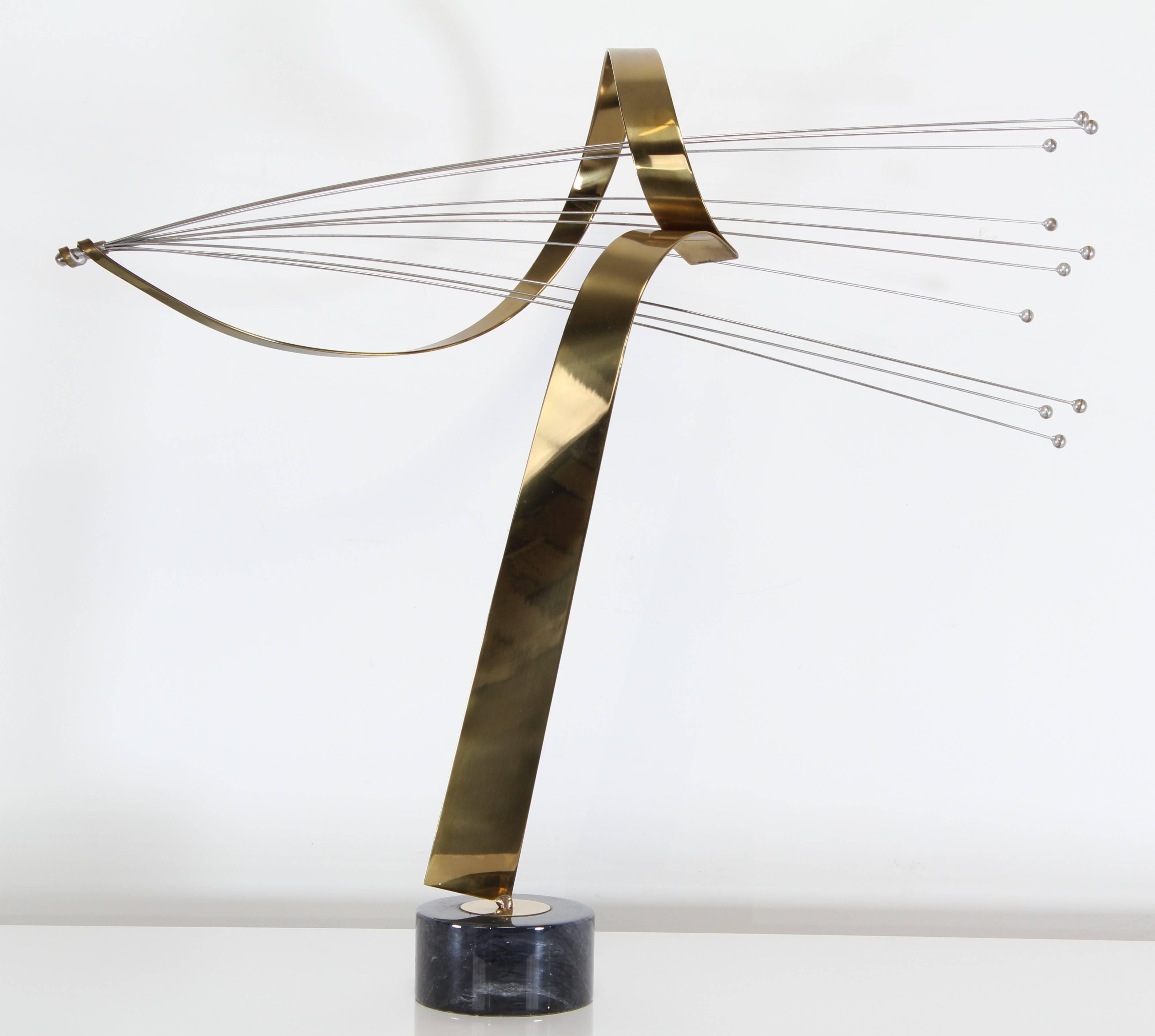 A large steel and brass abstract sculpture with multi rod spray and ribbon design on a black marble pedestal base by Curtis Jere.

Dimensions: 32