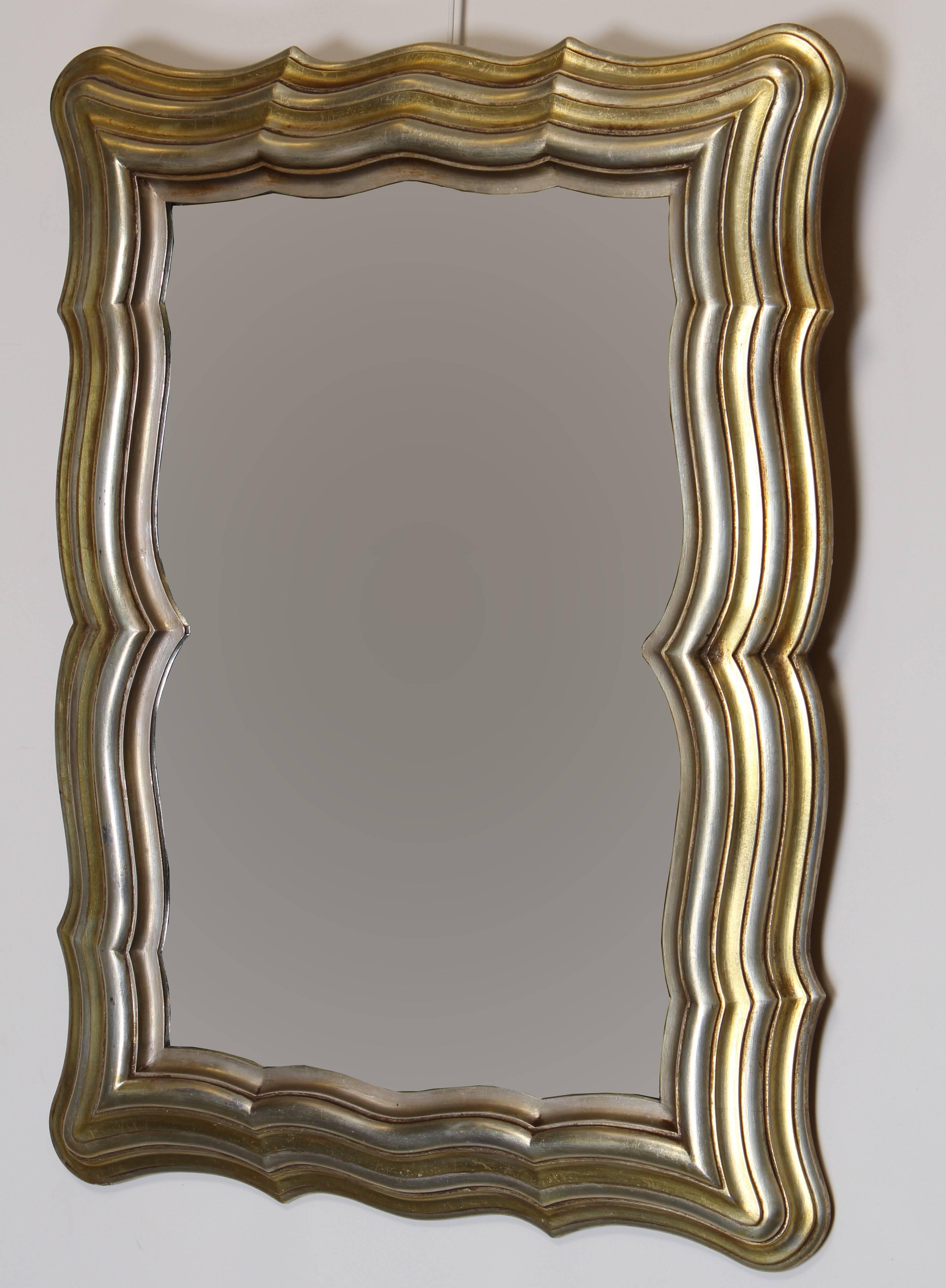 A distinctive Italian silver and gold gilt hand-carved scalloped wood mirror.

Please request shipping quotes for your specific zip code, most USA locations will be cheaper than the quoted flat rated shipping.

Dimensions: 38.25