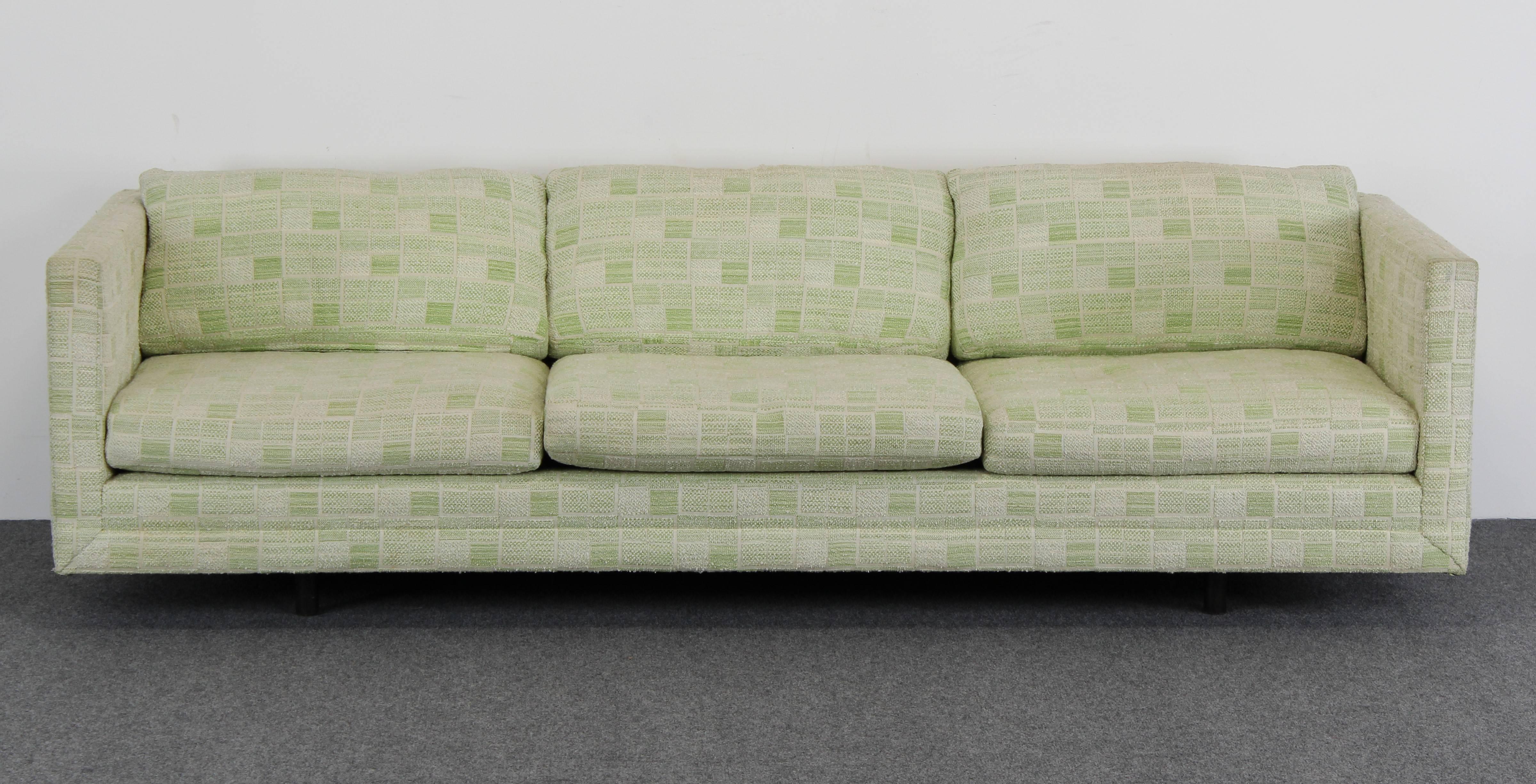 A three-seat Tuxedo sofa, circa 1960s by Harvey Probber. Original green fabric labeled Harvey Probber. The sofa rests on four wood dowel legs. Fabric shows signs of wear. New upholstery recommended. Measures: Seat height is 15