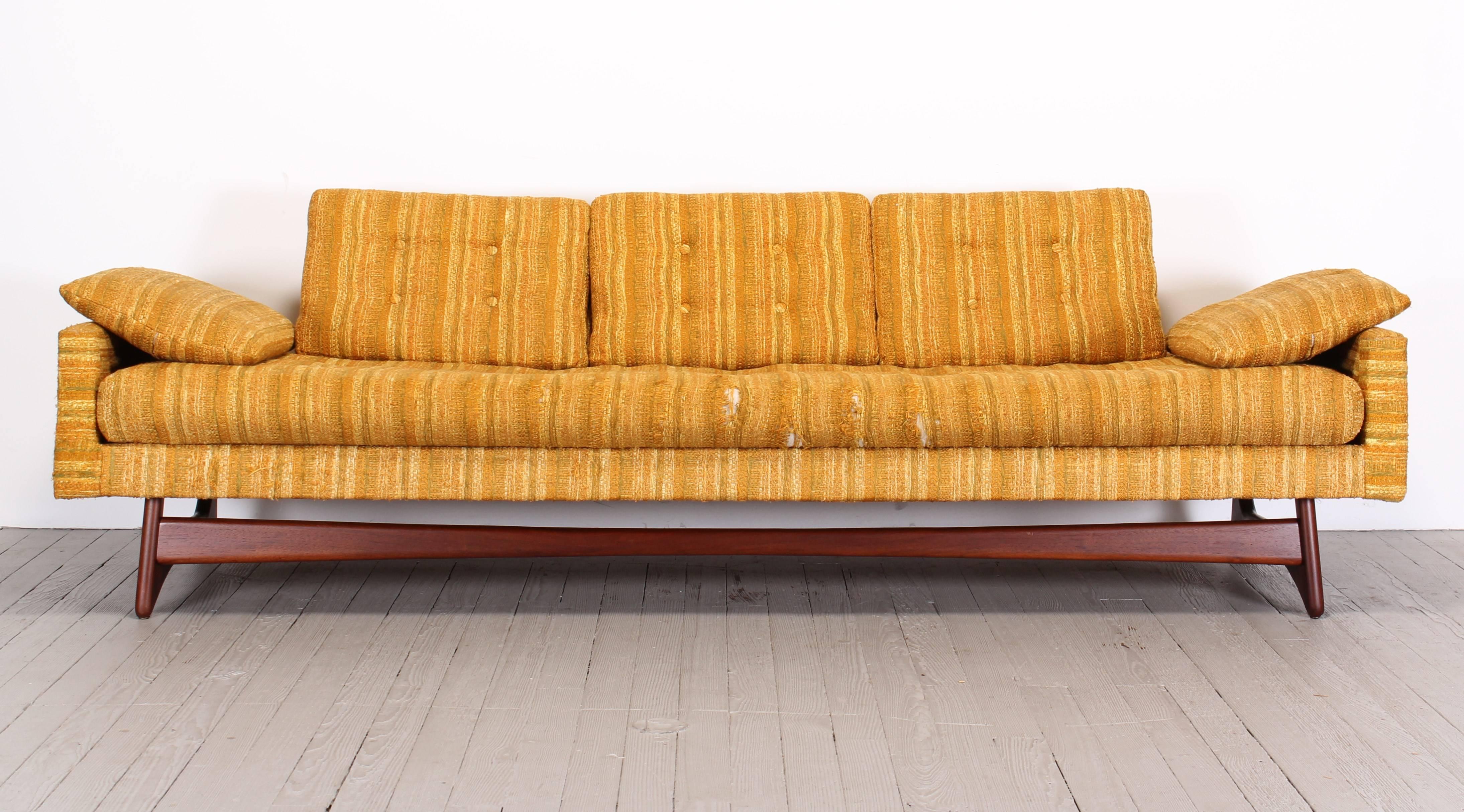 A sofa, model 2408 by Adrian Pearsall for Craft Associates, 1960. New upholstery needed. Walnut base newly refinished. Dimensions found below. Seat depth without back cushions 27