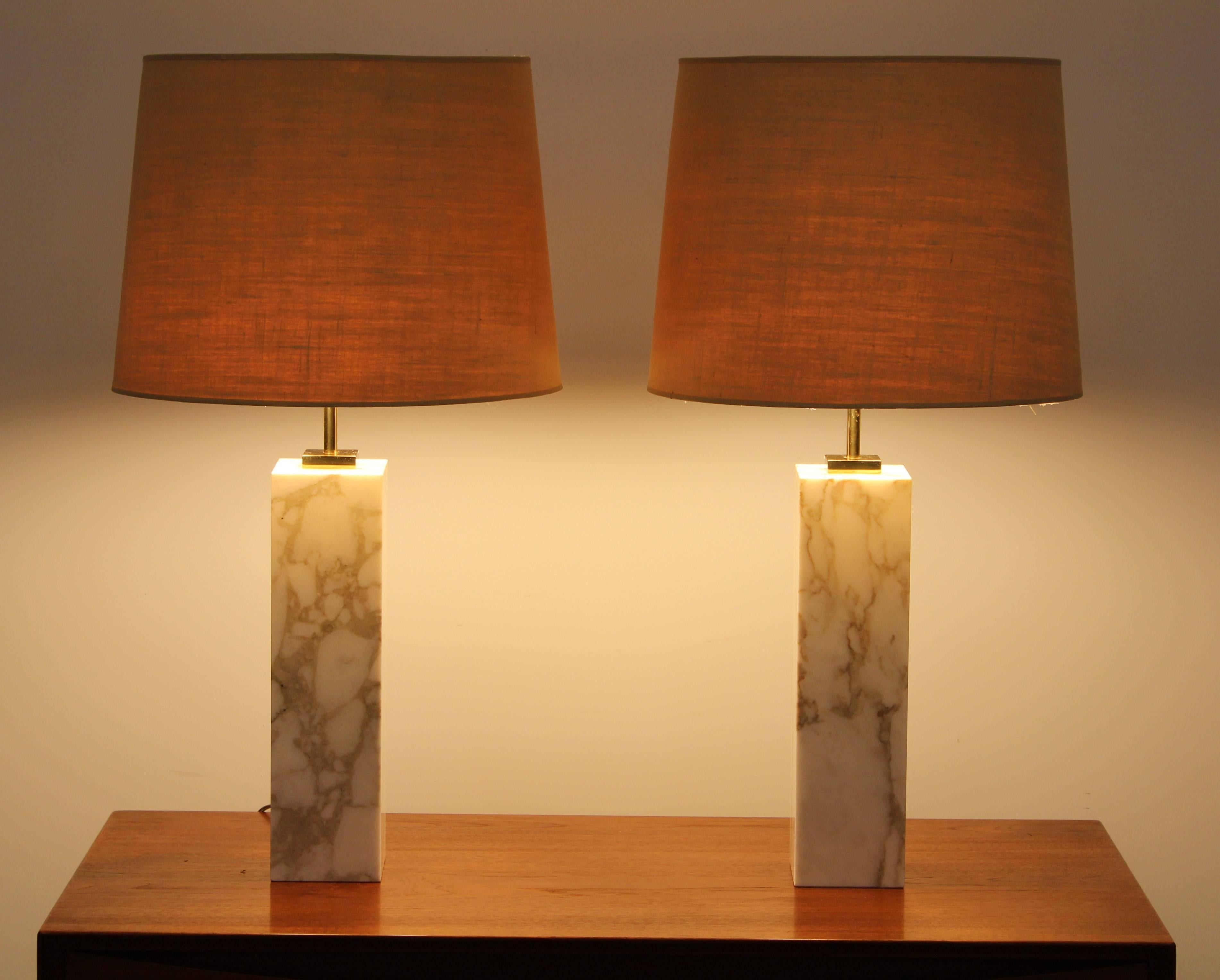 A handsome pair of marble lamps designed by T.H. Robsjohn-Gibbings for Hansen, 1970. Lamps have been newly rewired. Shades not included.  