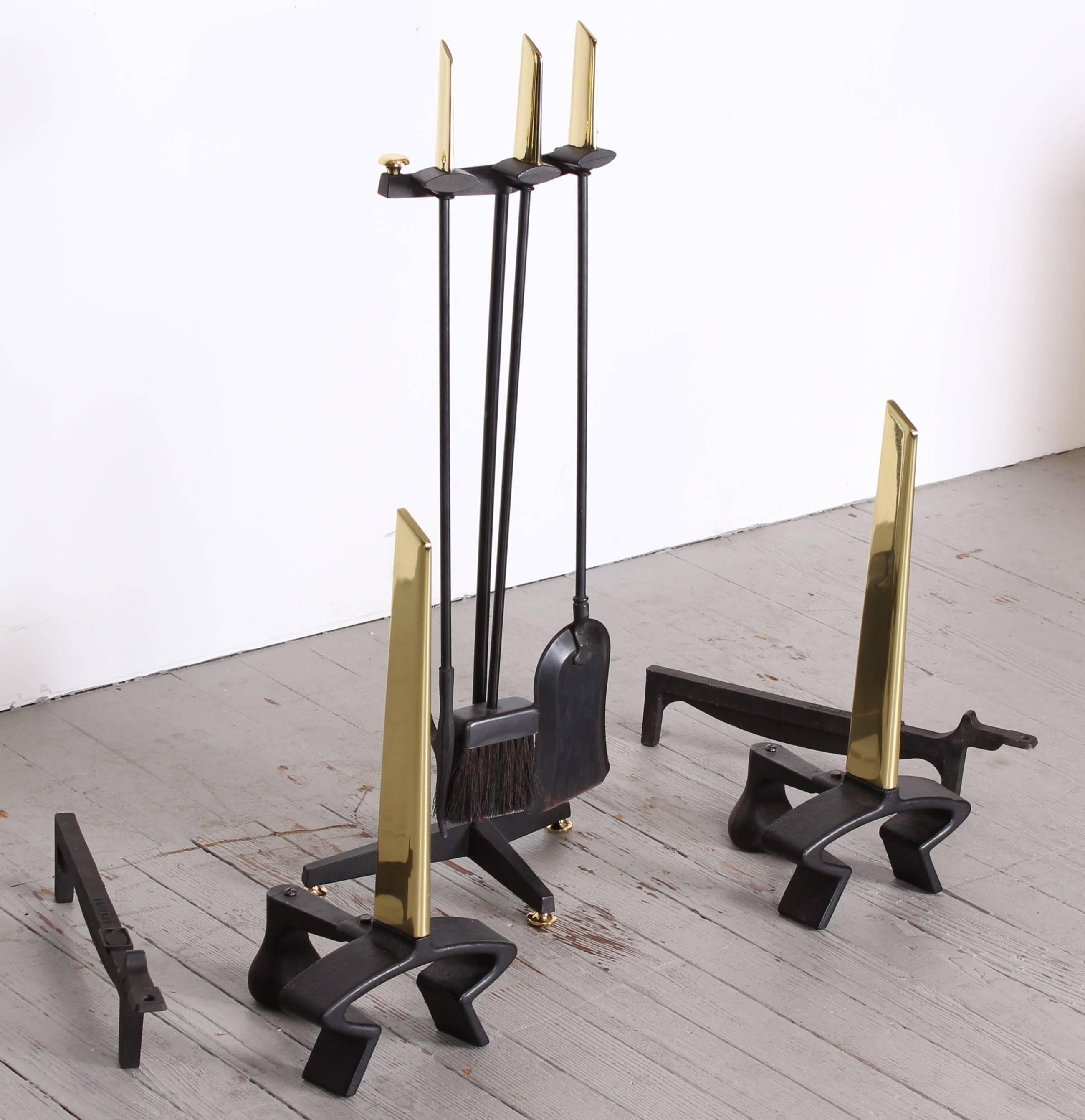 A sleek set of andirons and fireplace tool set by Donald Deskey marked Bennett. Dimensions of tools found below. Dimensions of andirons are 19.25