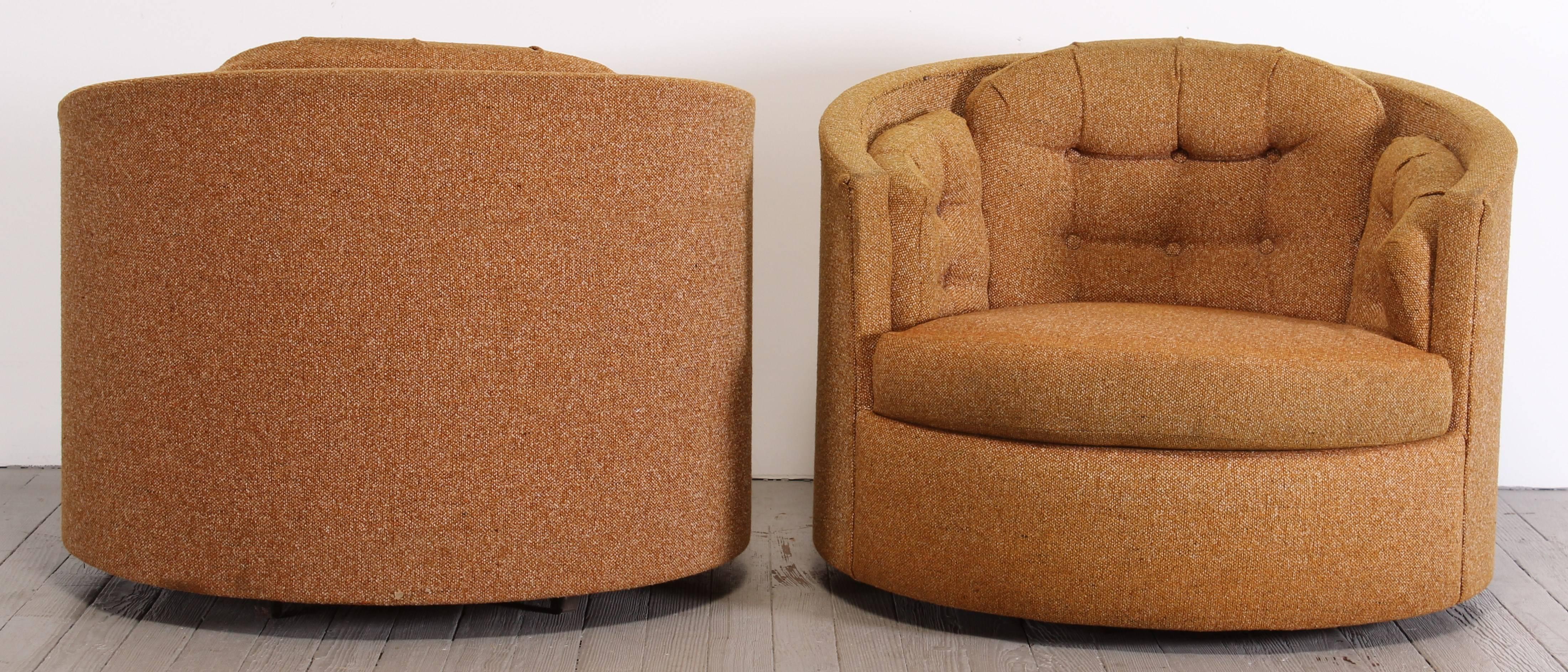Pair of swiveling lounge chairs in the style of Milo Baughman. New York City delivery would be $249.