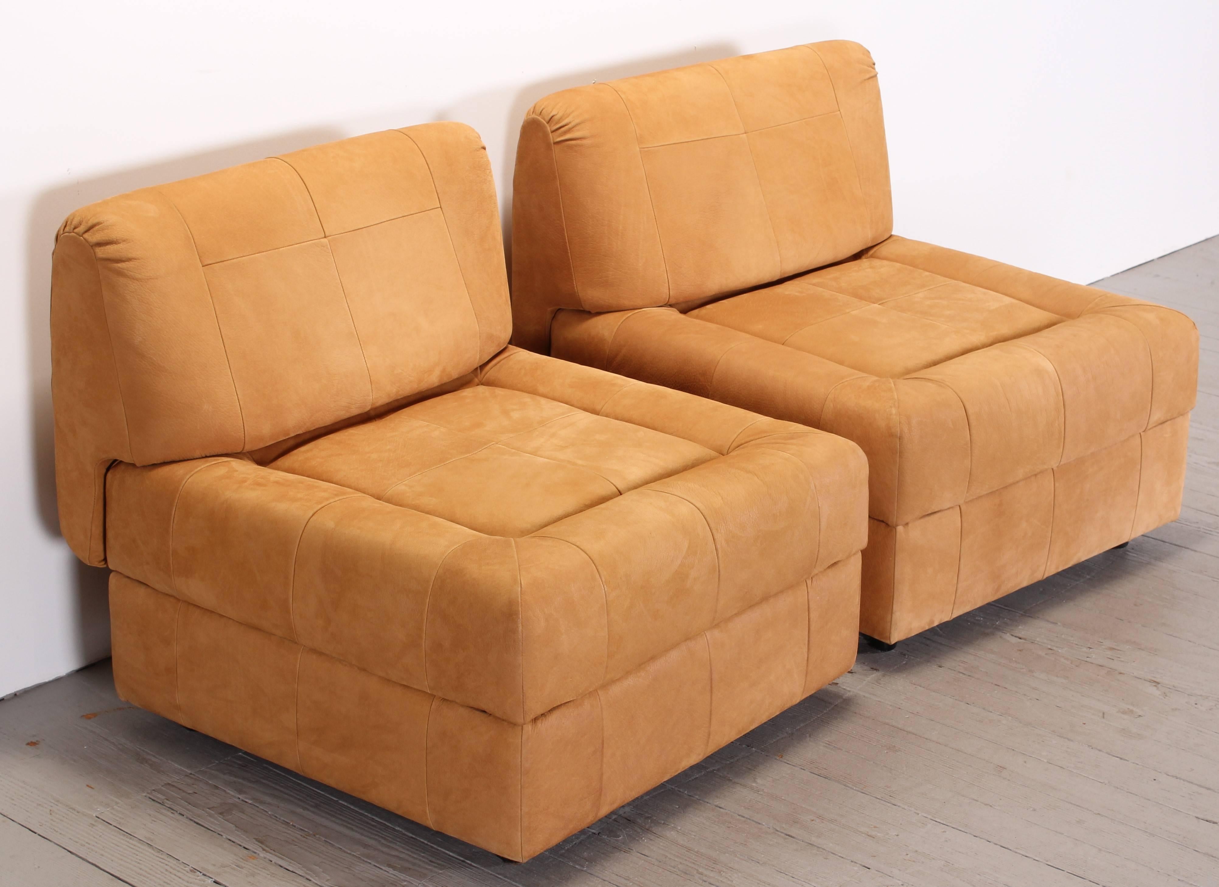 A fabulous pair of Brazilian suede leather lounge chairs, labeled Lafer, 1970. The backs are removable and make a pair of ottomans depending on how you would like to utilize the chairs. Dimensions without backrest 27.50.