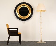 Poltrona Roche Bobois in pelle e legno scuro, XXI secolo