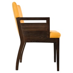 Poltrona Roche Bobois in pelle e legno scuro, XXI secolo