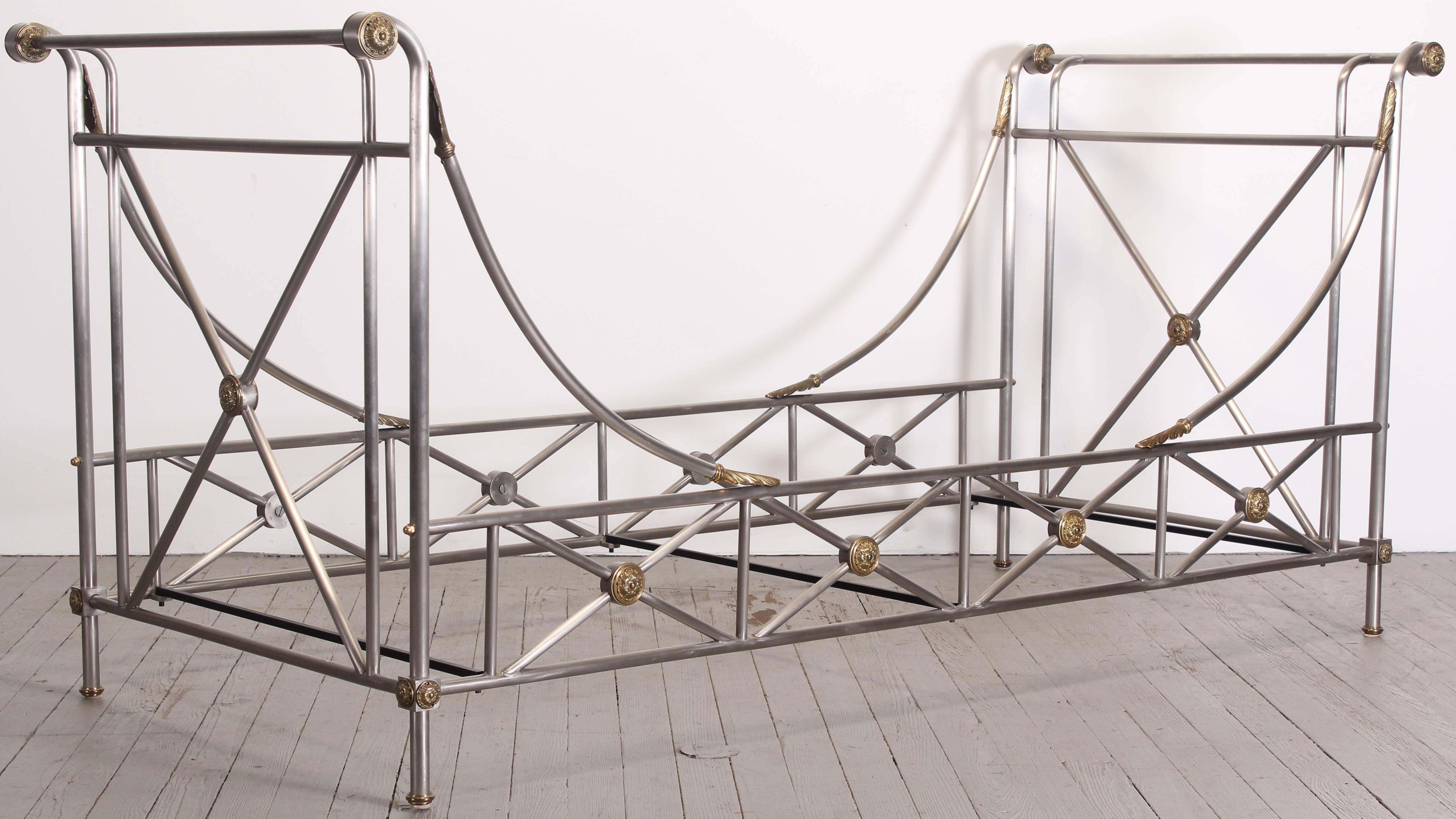 A stainless steel and brass Directoire/Neoclassical style daybed, possibly by Maison Jansen.

In very good condition, includes three metal mattress supports. Disassembles, making it easy to deliver and place.

Frame dimensions: 40.13" H x