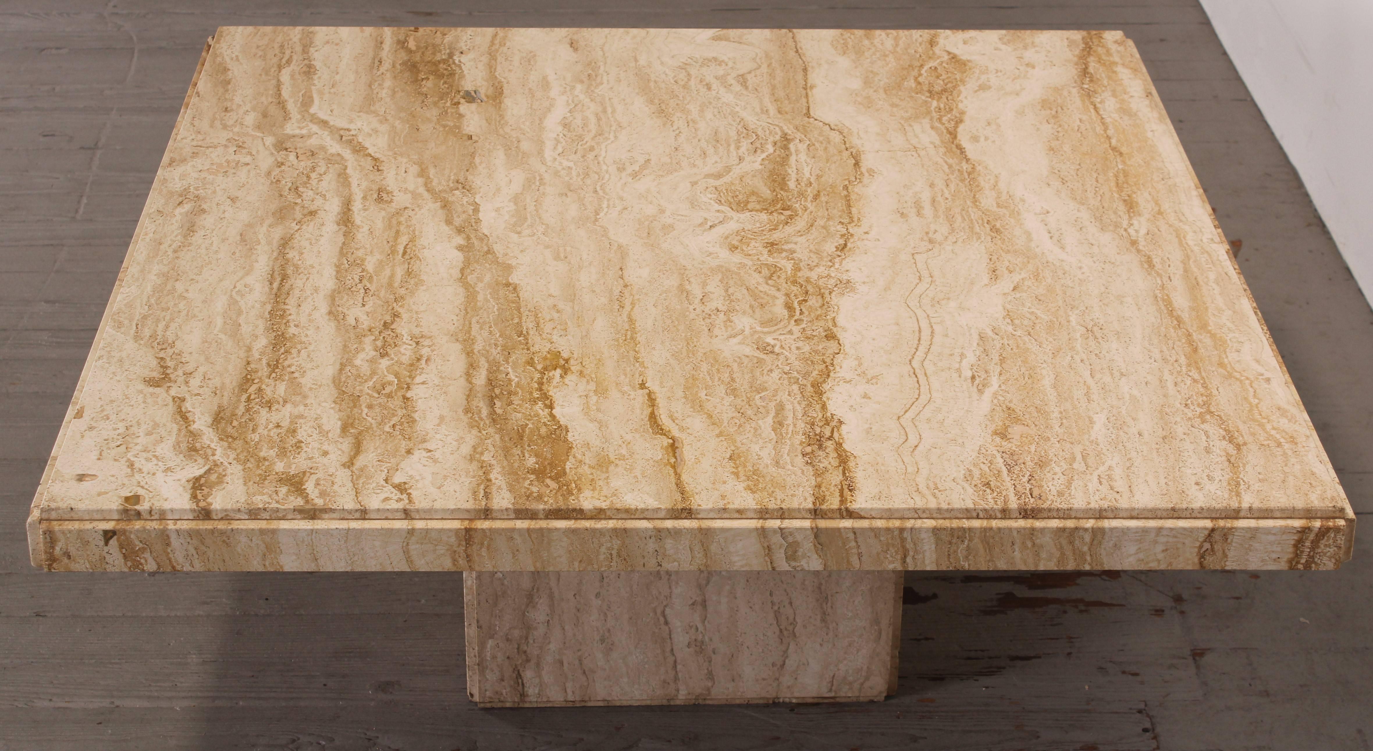 A modern functional two-piece variegated travertine square marble coffee  table. This is a very sturdy natural stone table that will look great in any modern or  traditional home.
