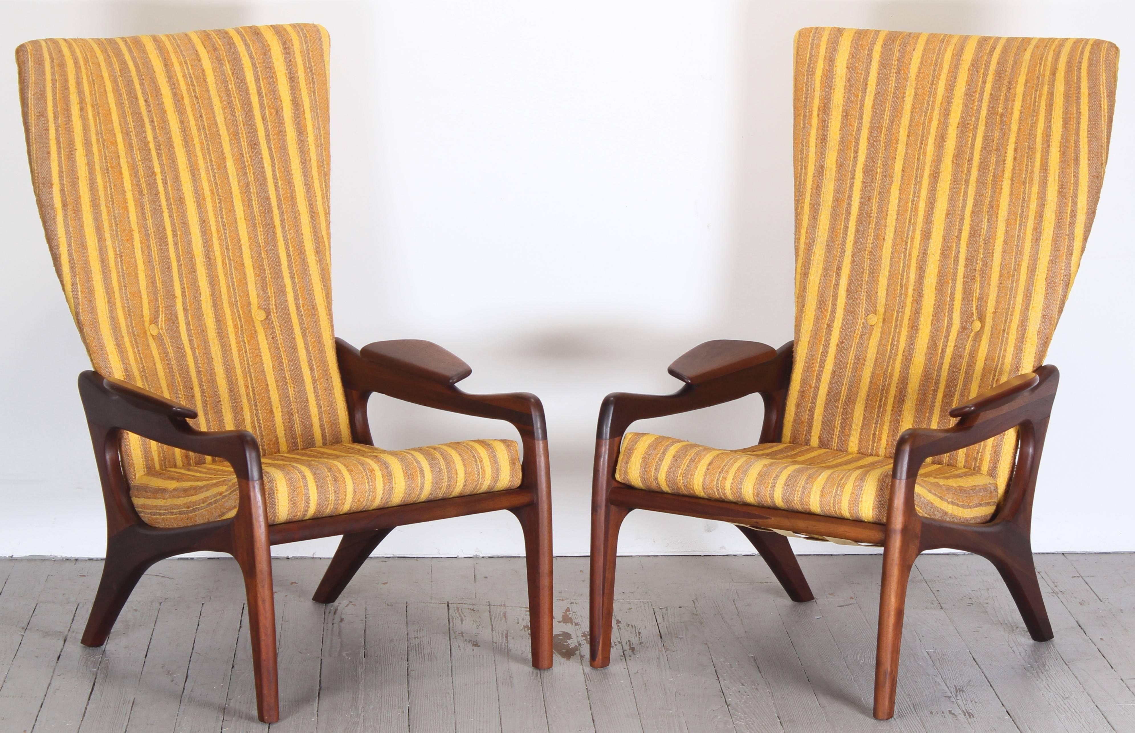 Pair of vintage sculptural wing back chairs designed by Adrian Pearsall for Craft Associates. These unique chairs are very comfortable. Walnut frames with original finish and upholstery.
The chairs need to be reupholstered. One cushion maintains