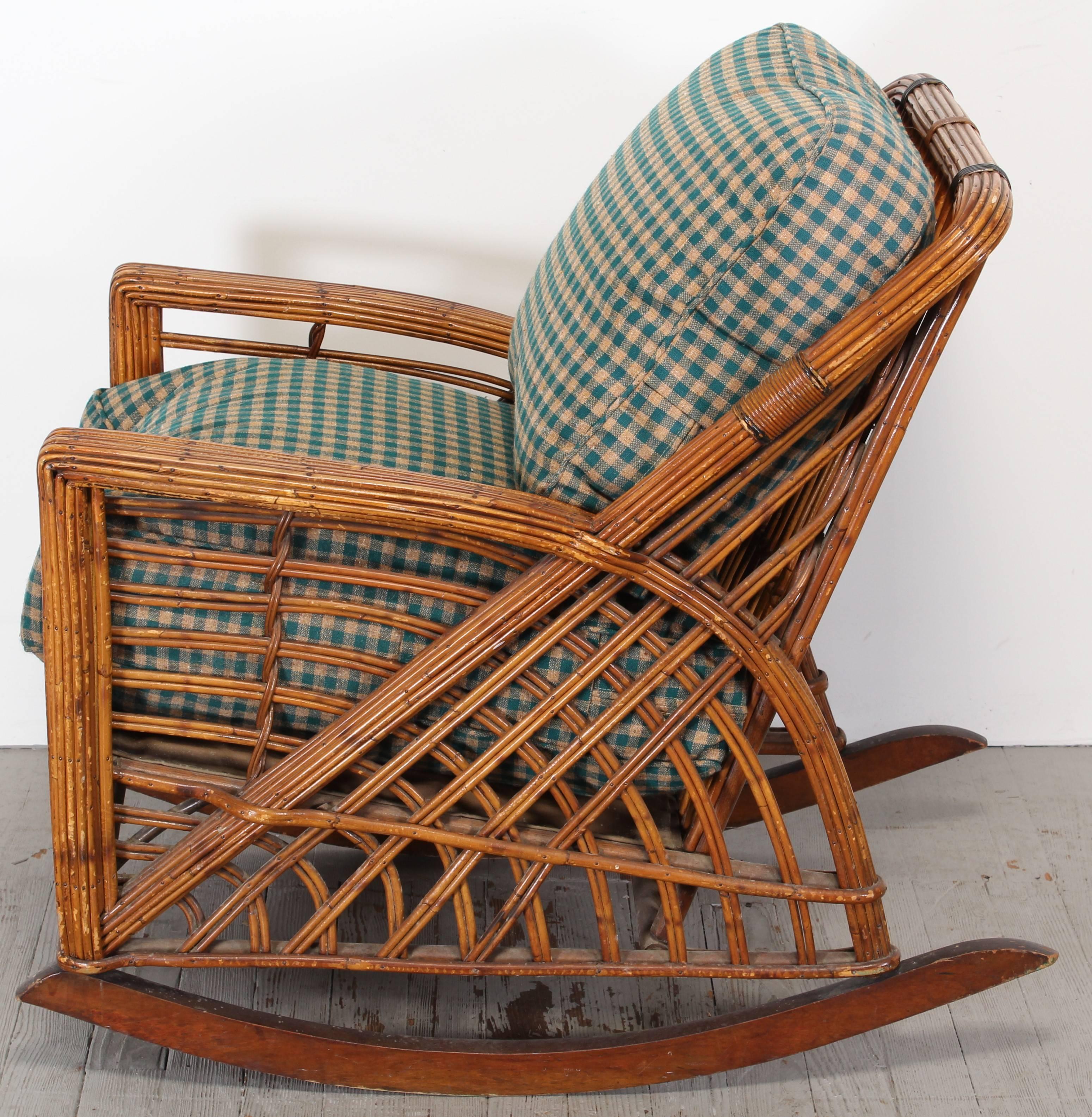 A very rare Art Deco stick reed rattan rocking chair with over stuffed cushions. There is a metal manufacturer's tag "Cramer MFG Co 253 So Fifth St Philadelphia PA". This is an adult rocker. The Cushions are very thick, very plush - soft.