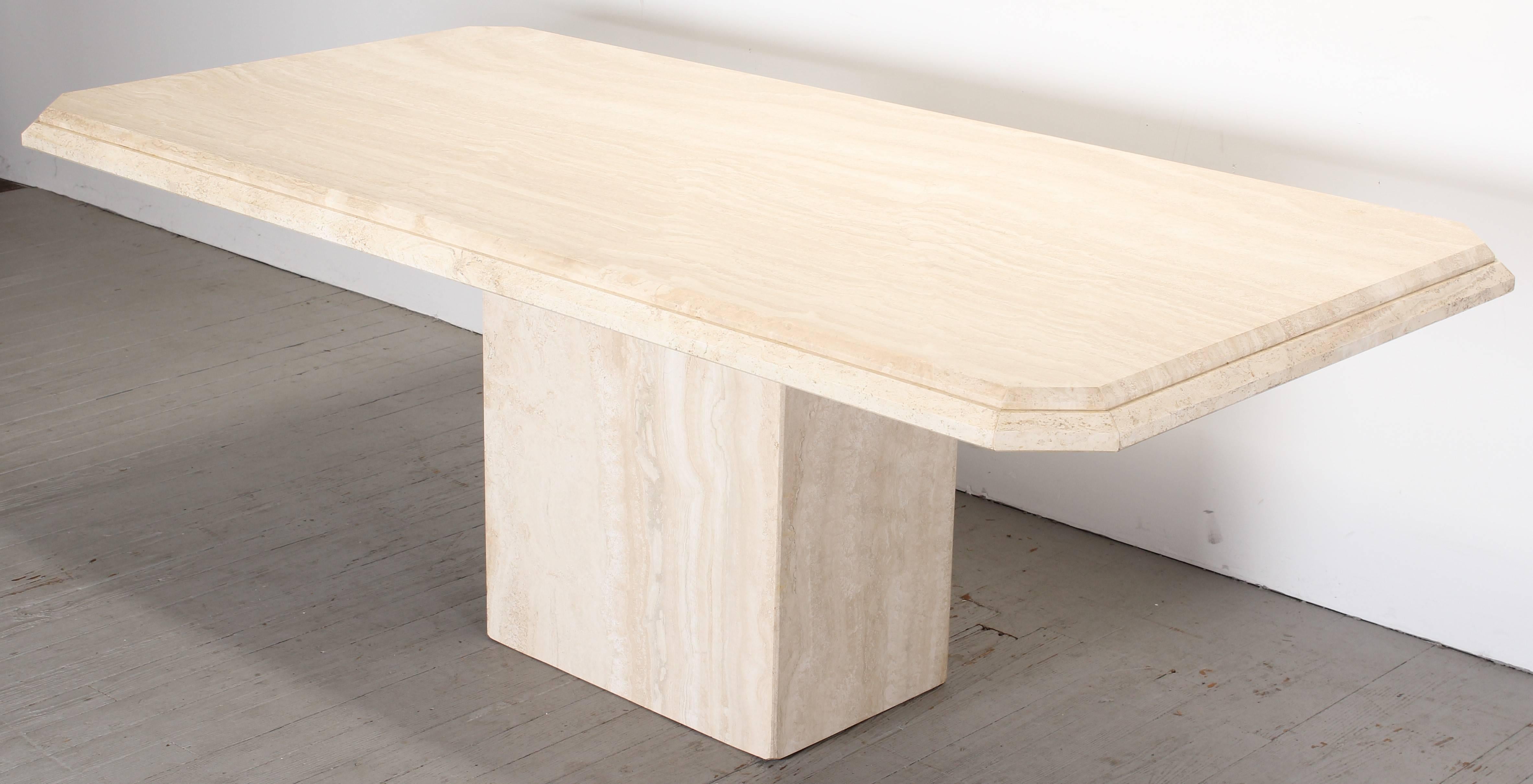 Travertine marble dining table in the style of Maurice Villency. The step edge rectangular dining table is in very good condition, age appropriate wear.
