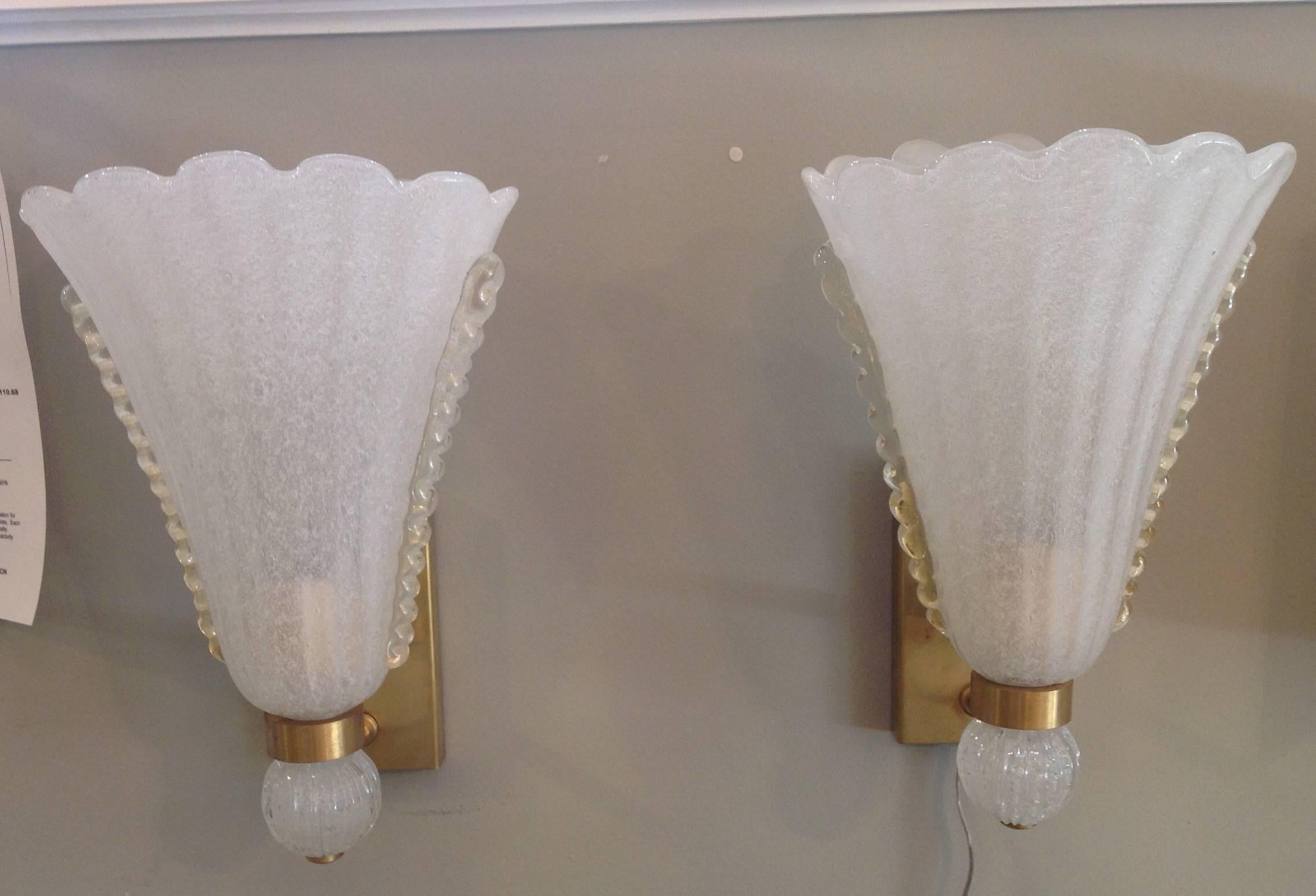 Pair of Barovier sconces in a white opaque bubbled glass with a clear design on the sides. They are single light with brass mounts.