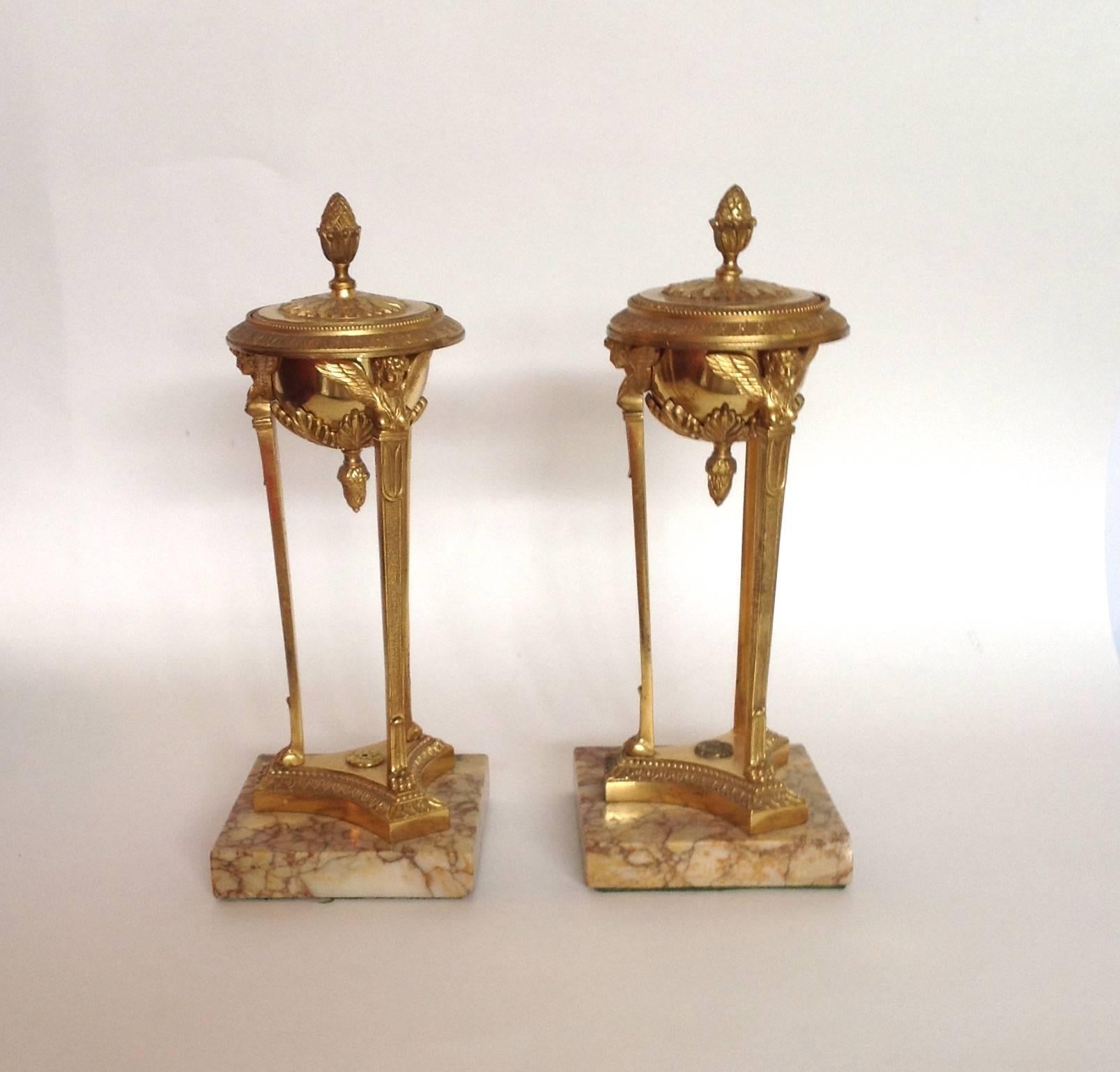 Pair of French Empire gilt bronze doré Athenienne candlesticks on marble bases. These are very high quality with Sienna marble bases, circa 19th century.