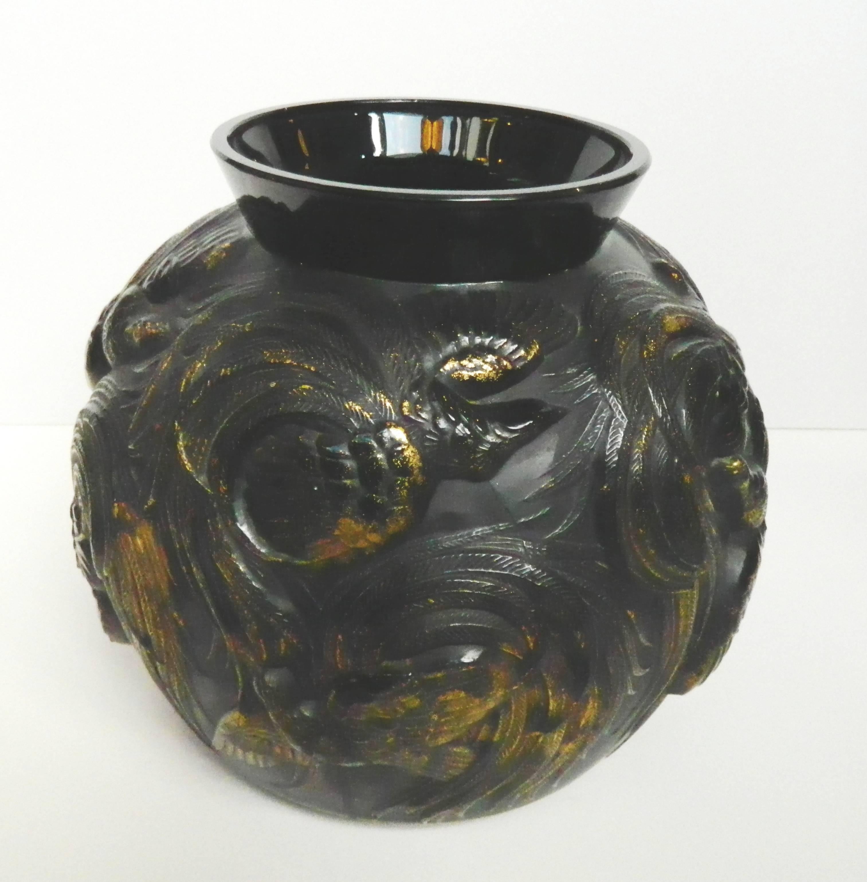 Huge French Sabino black glass vase molded with heavily raised swirling exotic tropical birds accented with gold highlights.
There is a large hand engraved script signature to the underside:
Sabino Paris made in France.

 