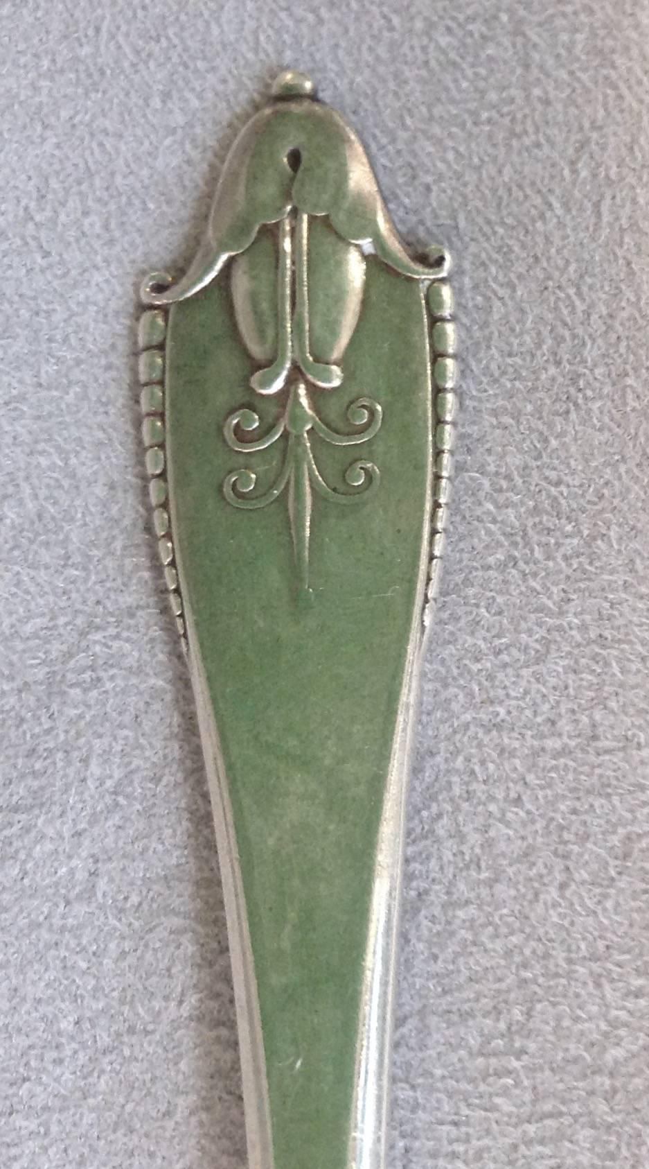 Rare Akkeleje pattern #77 sterling flatware designed by Georg Jensen in 1918. The set consists of 12 dinner forks, 16 salad forks, 12 dinner knives, 12 butter knives, 16 soup spoons, nine teaspoons, 12 demitasse spoons, three ladles, two small