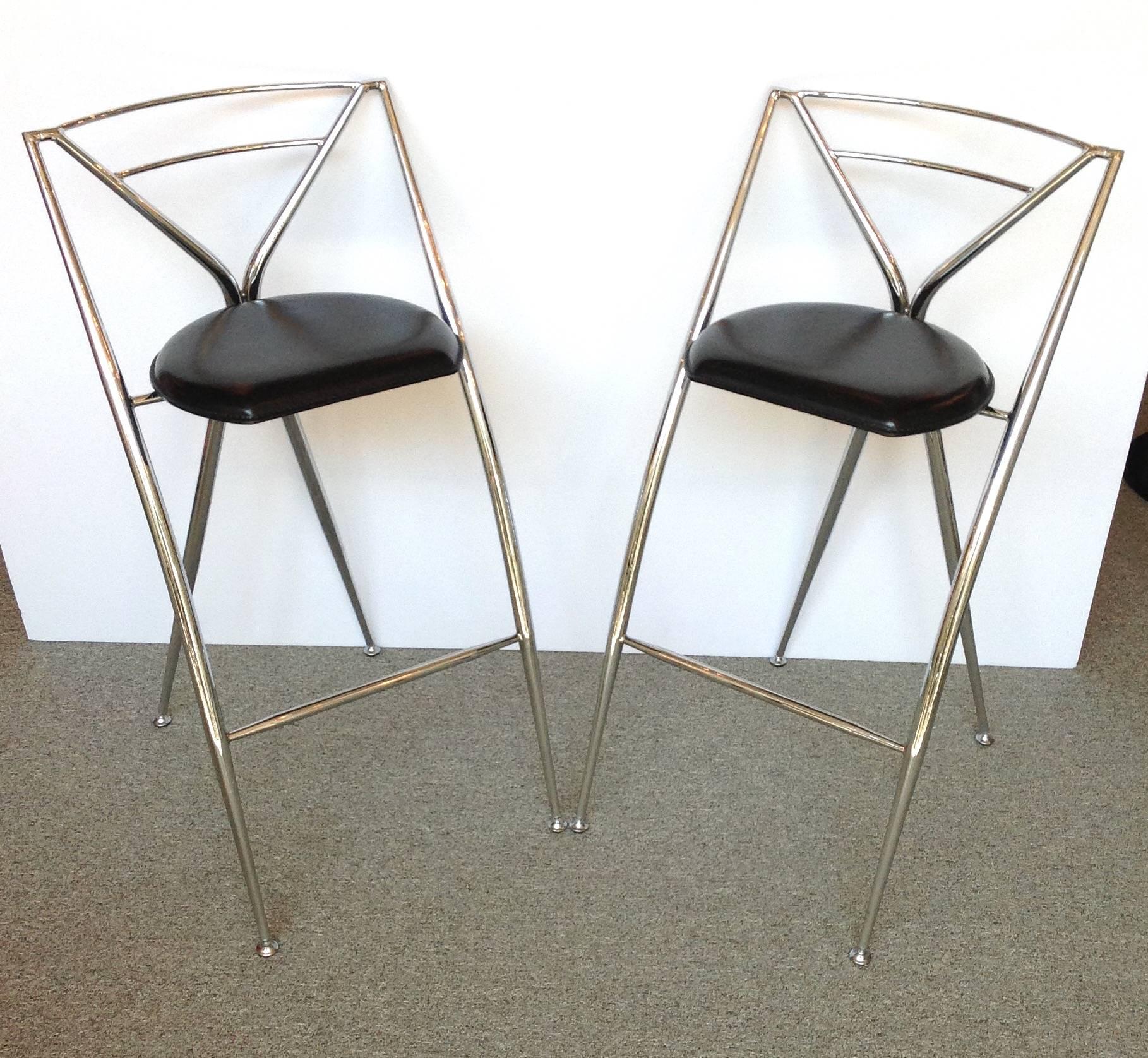 Pair of Hiroyuki Yamakado Cinderella folding stools with leather seats. They are constructed of tubular steel and equipped with pivoting and anti-skid feet. These were very well cared for.
Made in Paris, France, 1987.
  