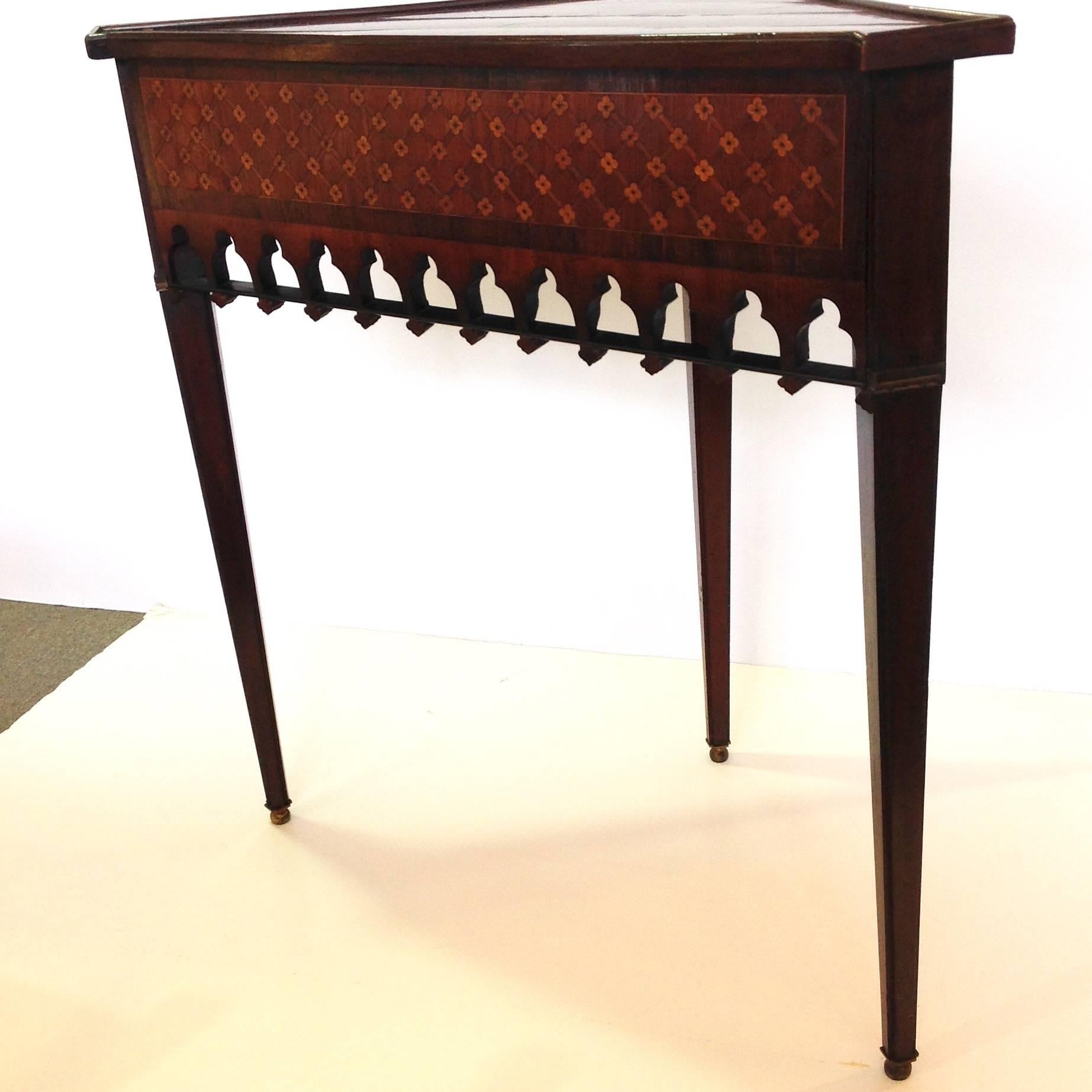 Gothic Revival corner table with inlaid floral lattice on apron and shaped front corners. It is possibly Dutch, early 19th century.