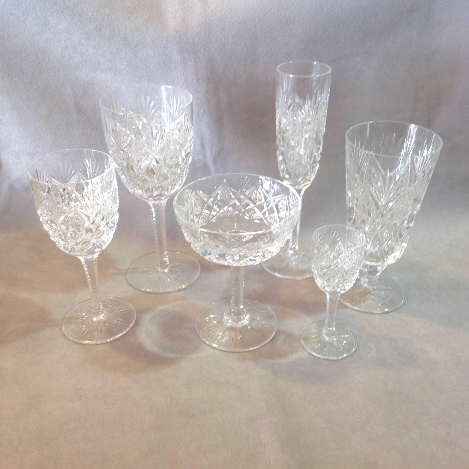 Group of 48 cut crystal stems made by Saint Louis in the Florence pattern with pineapple cut. There are six pieces per place setting for a service for eight. It was made from 1991 to 1903. It includes eight of each
water goblets 7 5/8",