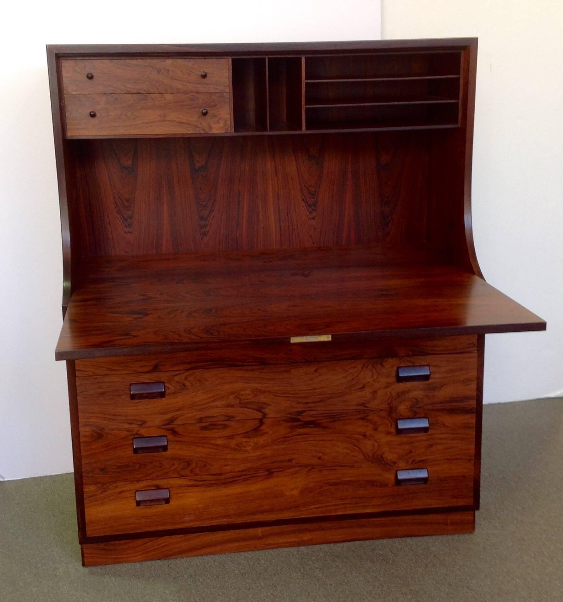 Drop front rosewood secretary desk designed by Børge Mogensen for Søborg Møbler. The drop-front has a flat writing surface and fitted interior. The key is included, circa 1960s. It is in excellent condition.
  