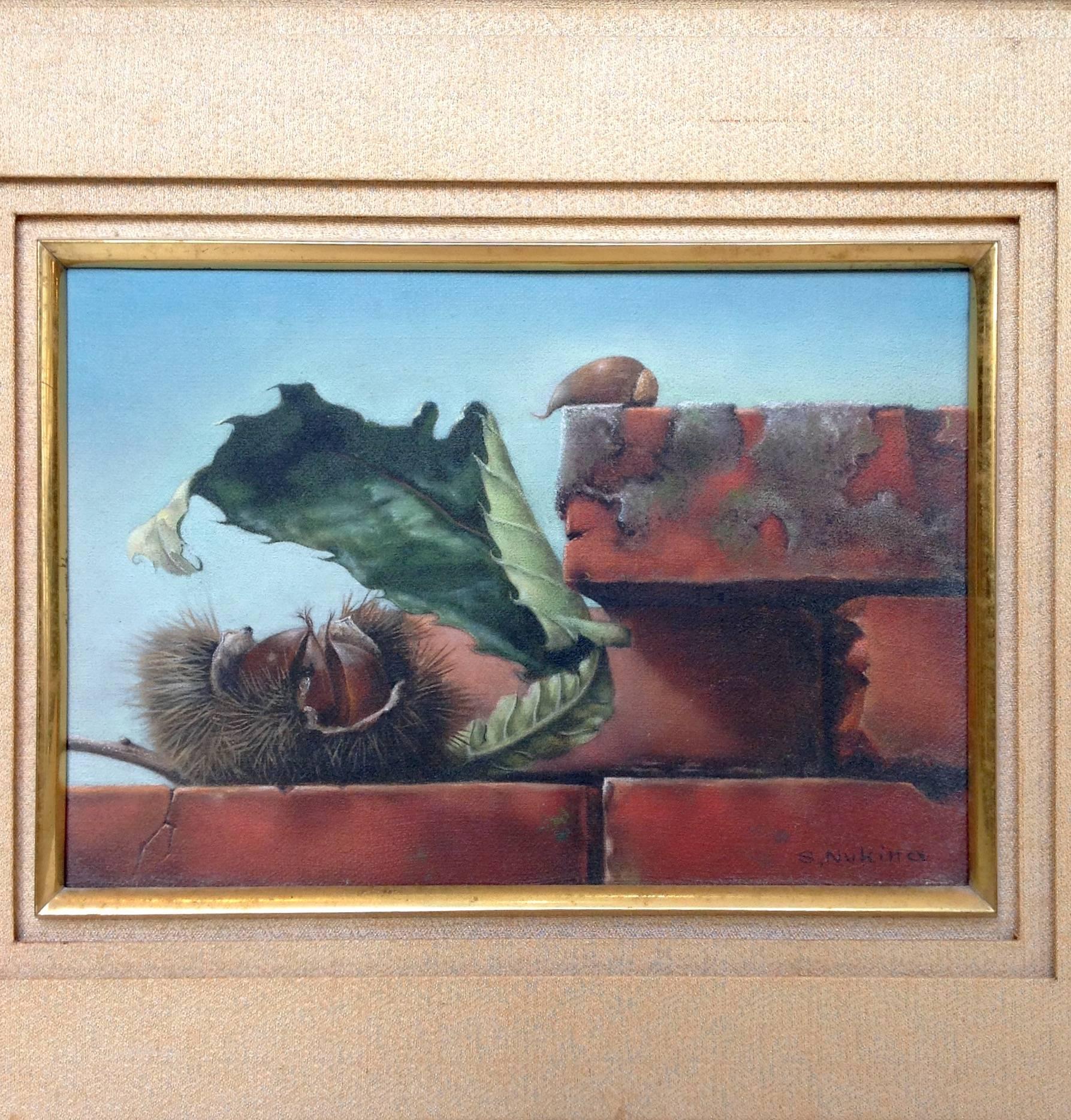 Small oil on canvas by Japanese artist Shiro Nukina depicting chestnuts resting on a brick wall. It has a wood frame and a silk brocade mat. Signed in the lower right.