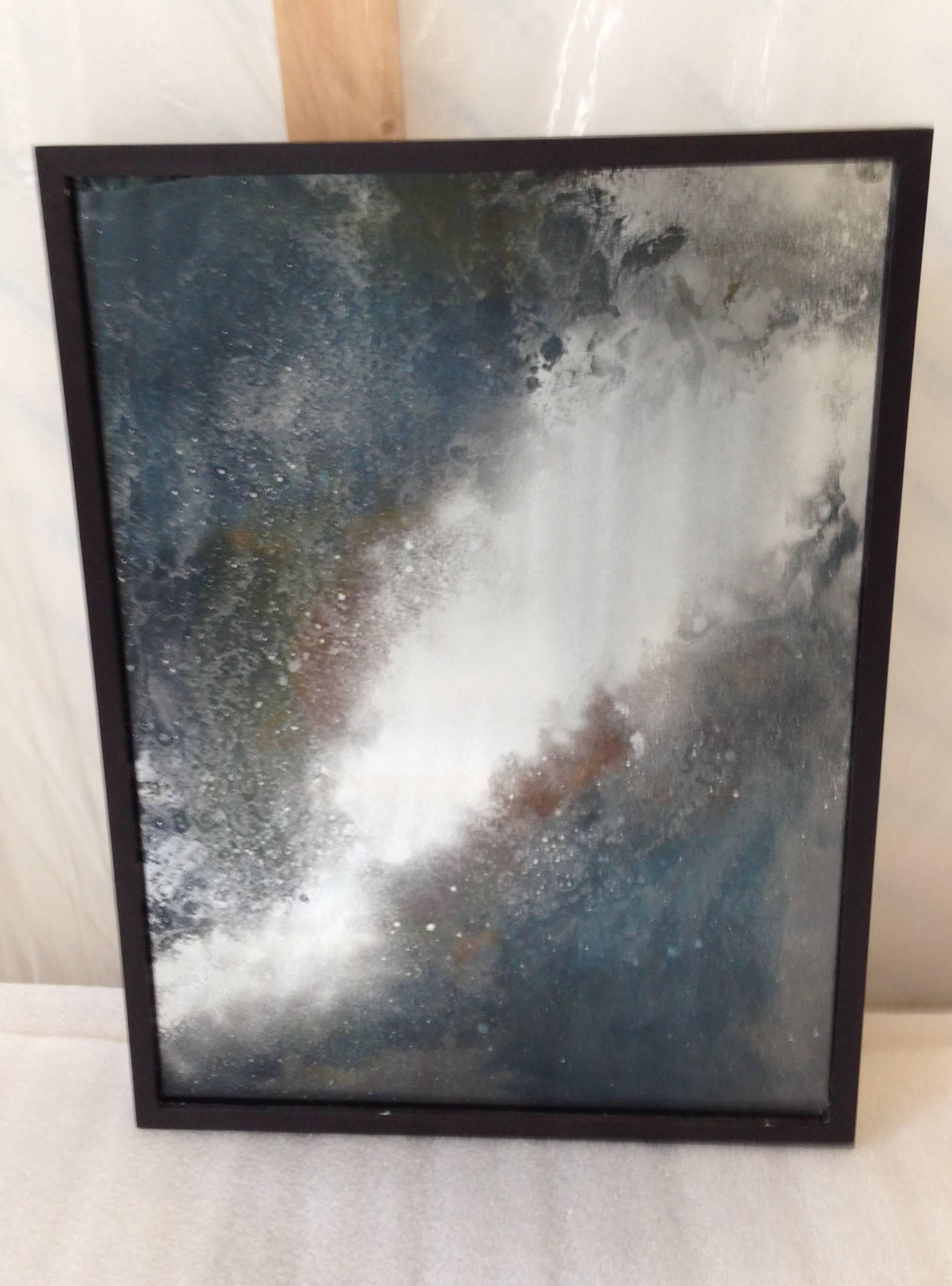Orion shows a dramatic triptych of custom made nebula mirrors, with clouds of silvering flowing across the expanse of glass, layered with coloured translucent resin and further silvering, giving a sense of shifting depth to the piece. 

There are
