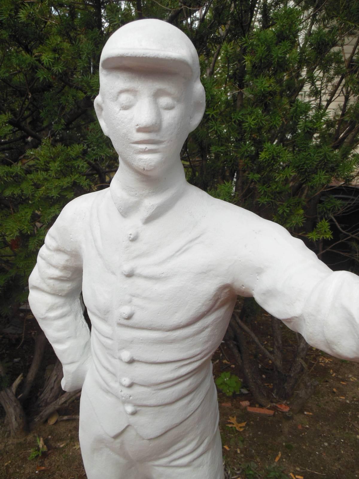 This is an American cast iron jockey, that has been sand blasted and painted only with a white primer. This will allow the jockey to be painted in the color silks of your choice. .