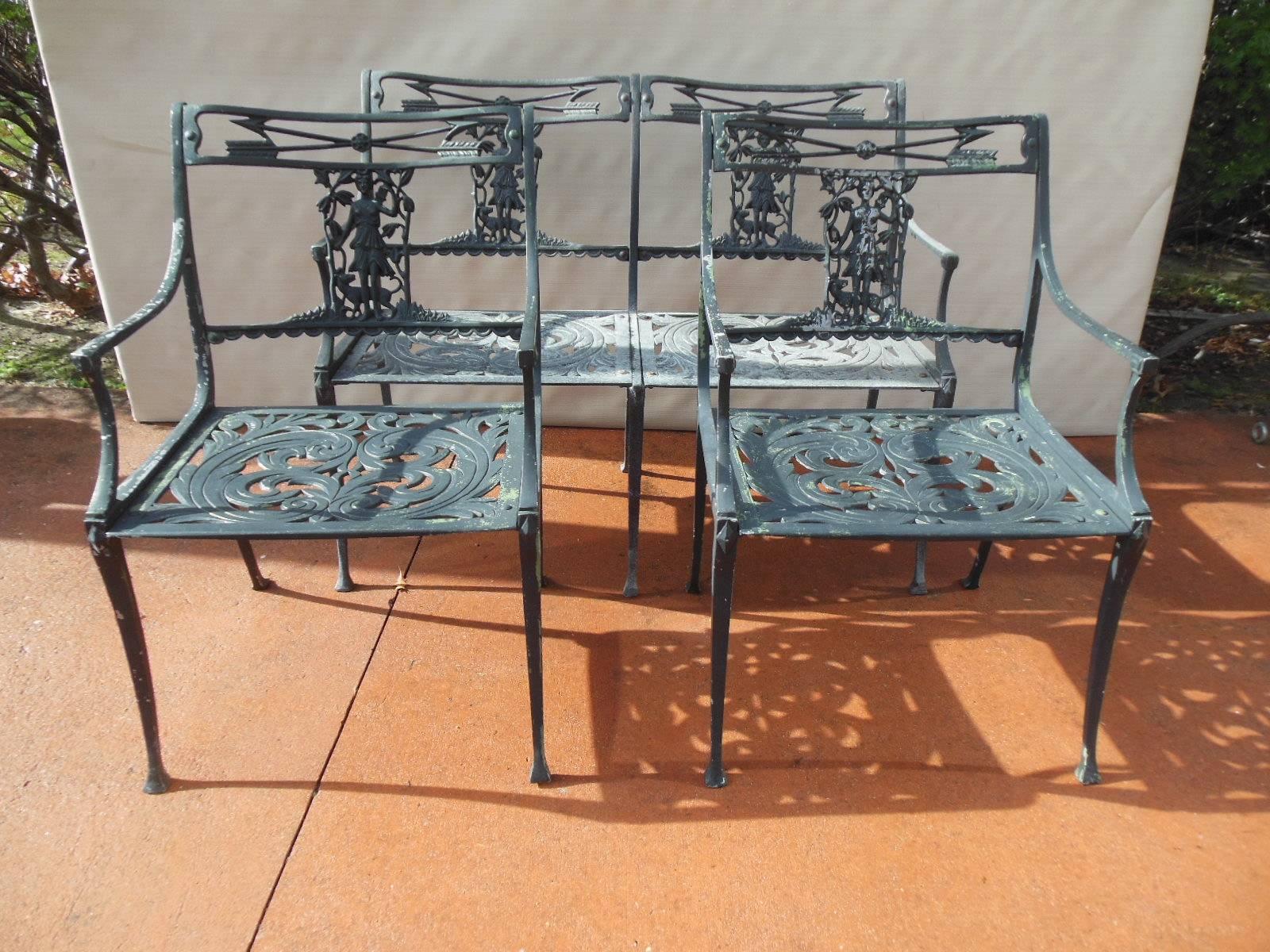 An unusual vintage cast aluminum three piece patio set, consisting of a bench and two armchairs. The set in the desirable Diana the Huntress Pattern, with a central figure of Diana on the chair back. All pieces in the original finish, showing signs