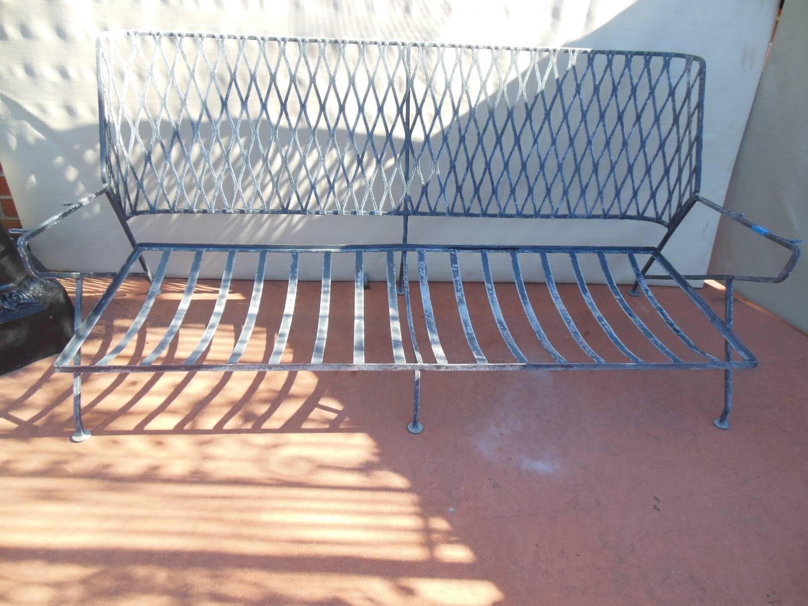 A six-piece Salterini wrought iron patio set, in the Mid-Century Modern style.
Designed by Maurizio Tempestini for Salterini. The set was found in South Beach, where it sat on a waterfront terrace for over 50 years. The set consists of a large