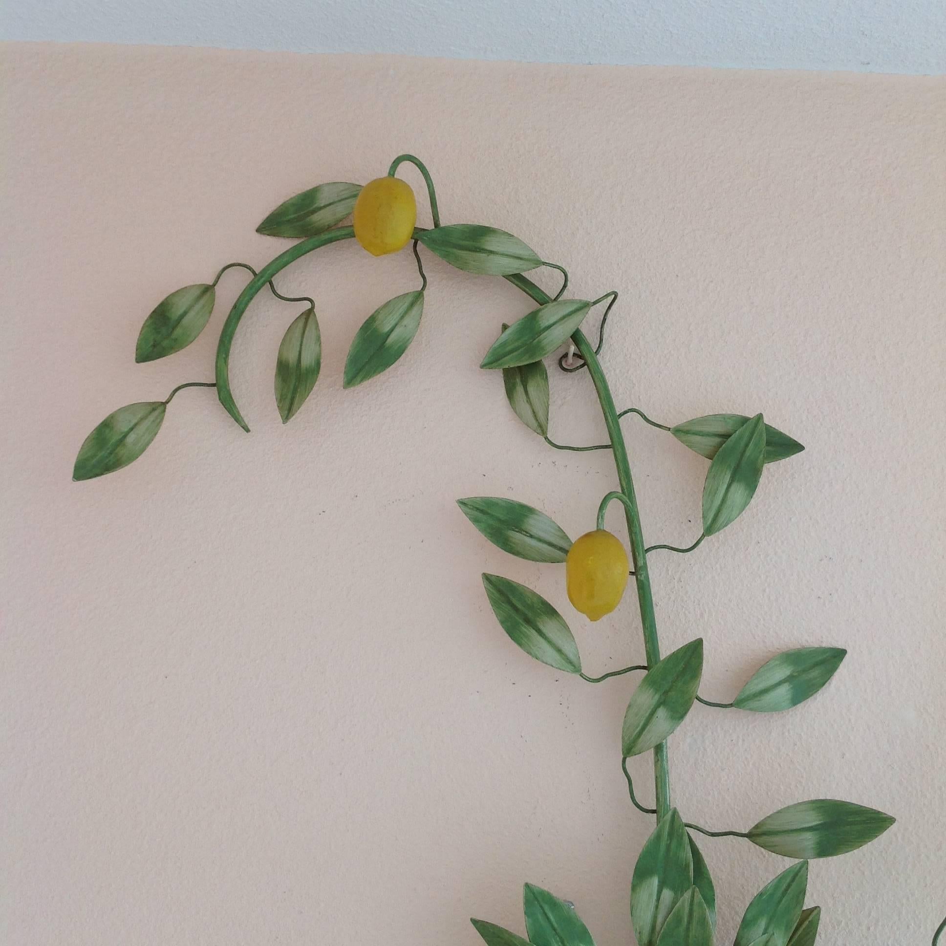 A Hollywood Regency lemon tree, that is electrified and fitted for two light bulbs. The painted finish is original and in excellent condition. This decorative lemon tree wall model is not easily found.