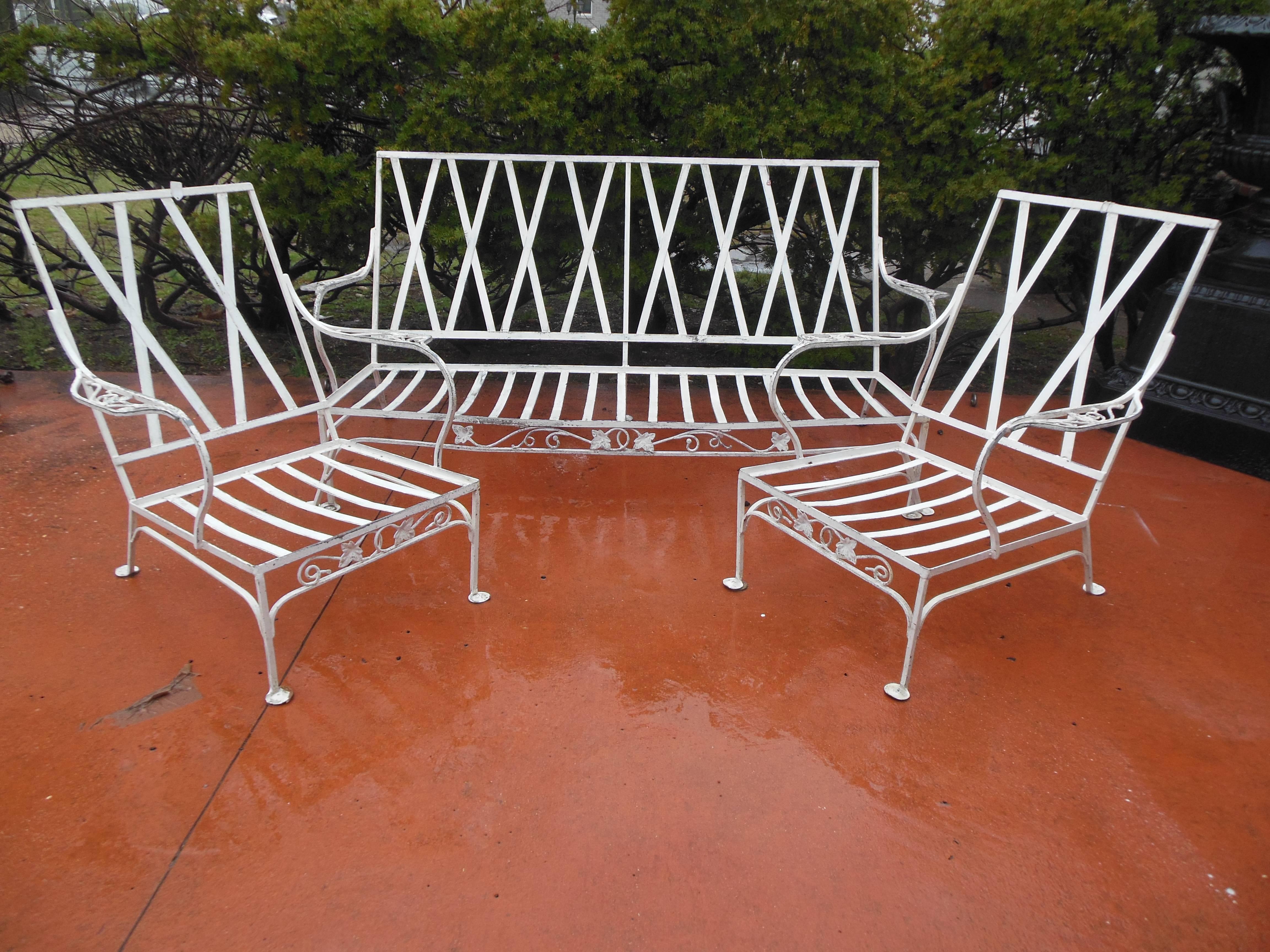 A vintage wrought iron three piece patio set by Salterini. The Salterini set is in the
Iconic Mt Vernon pattern, consisting of the sofa and a pair of matching Salterini armchairs. The painted finish is usable, especially with a paint touch up.