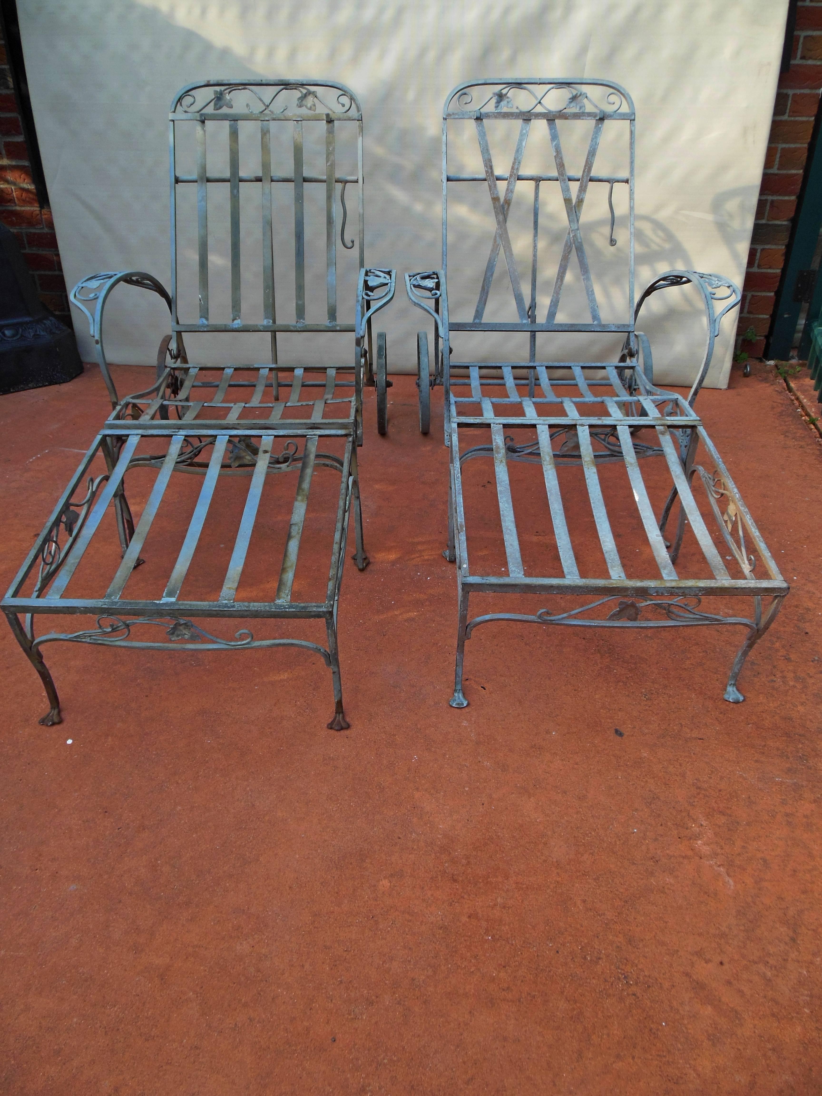 Offered here are a pair of Salterini, wrought iron two-piece chaises (or a chair with matching ottoman), in the iconic Mt Vernon pattern. These wrought iron Salterini pieces have never been painted and are in the desirable Neva-Rust finish. The