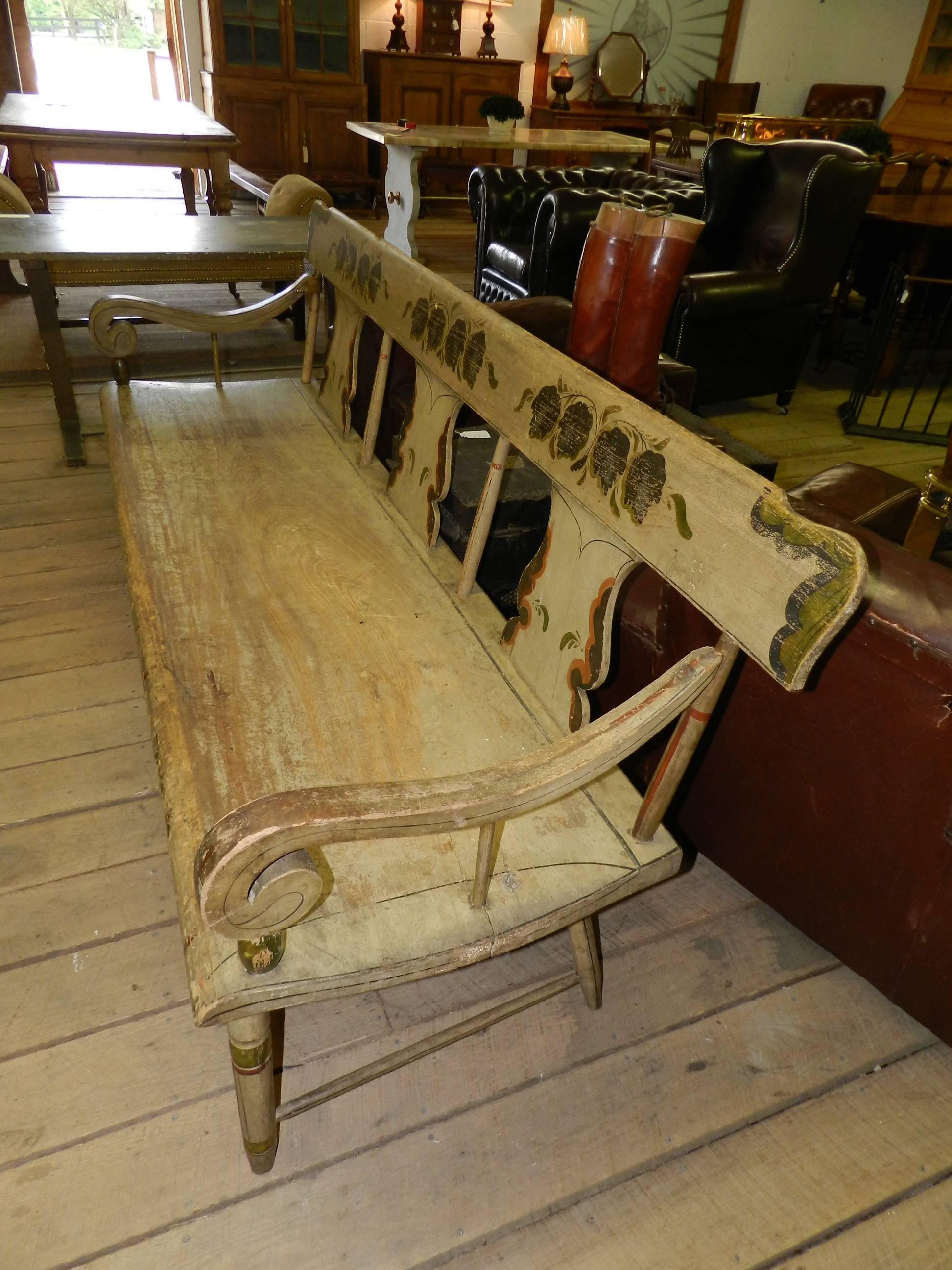 Antique Virginia pine bench with original paint, scroll arms and turned legs.