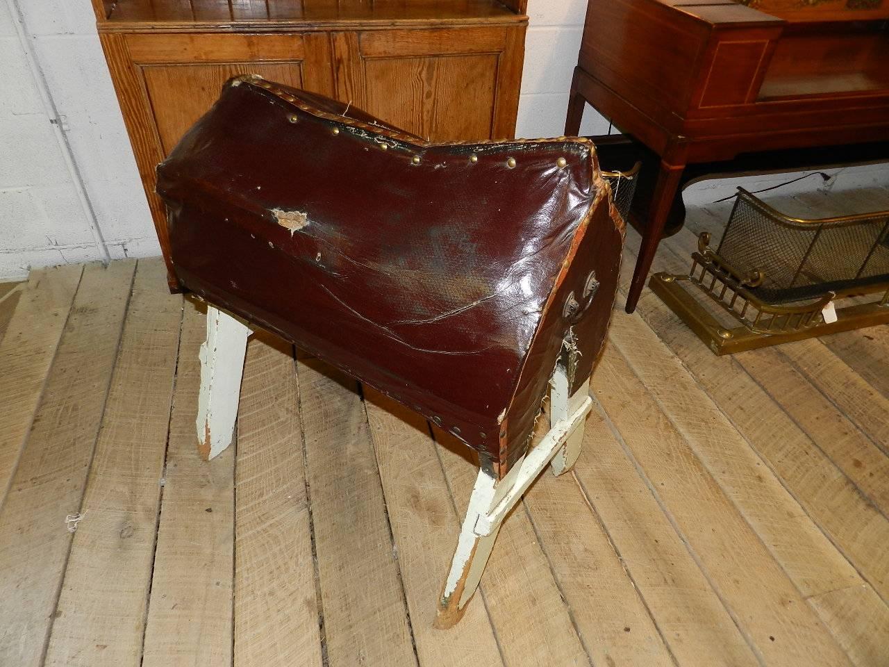 Antique leather covered stand from a former saddlery in Sandon, England. This unique piece was used for trying out breeches and also for a saddle stand.