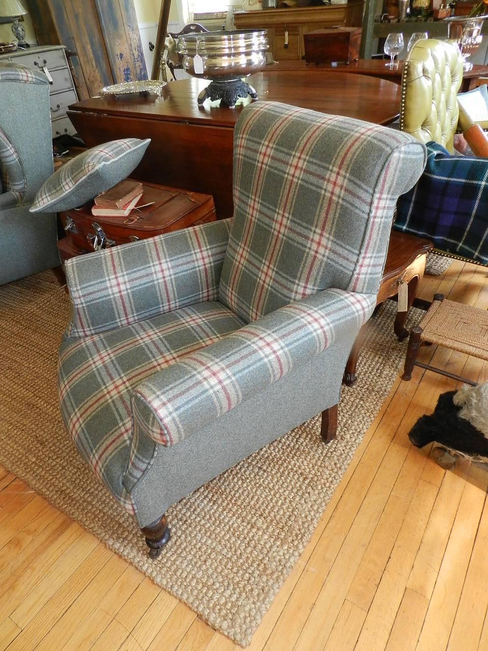 Antique armchair with mahogany turned legs. This armchair has been completely refurbished and covered using wool tweed from Abraham Moon, Yorkshire, England.