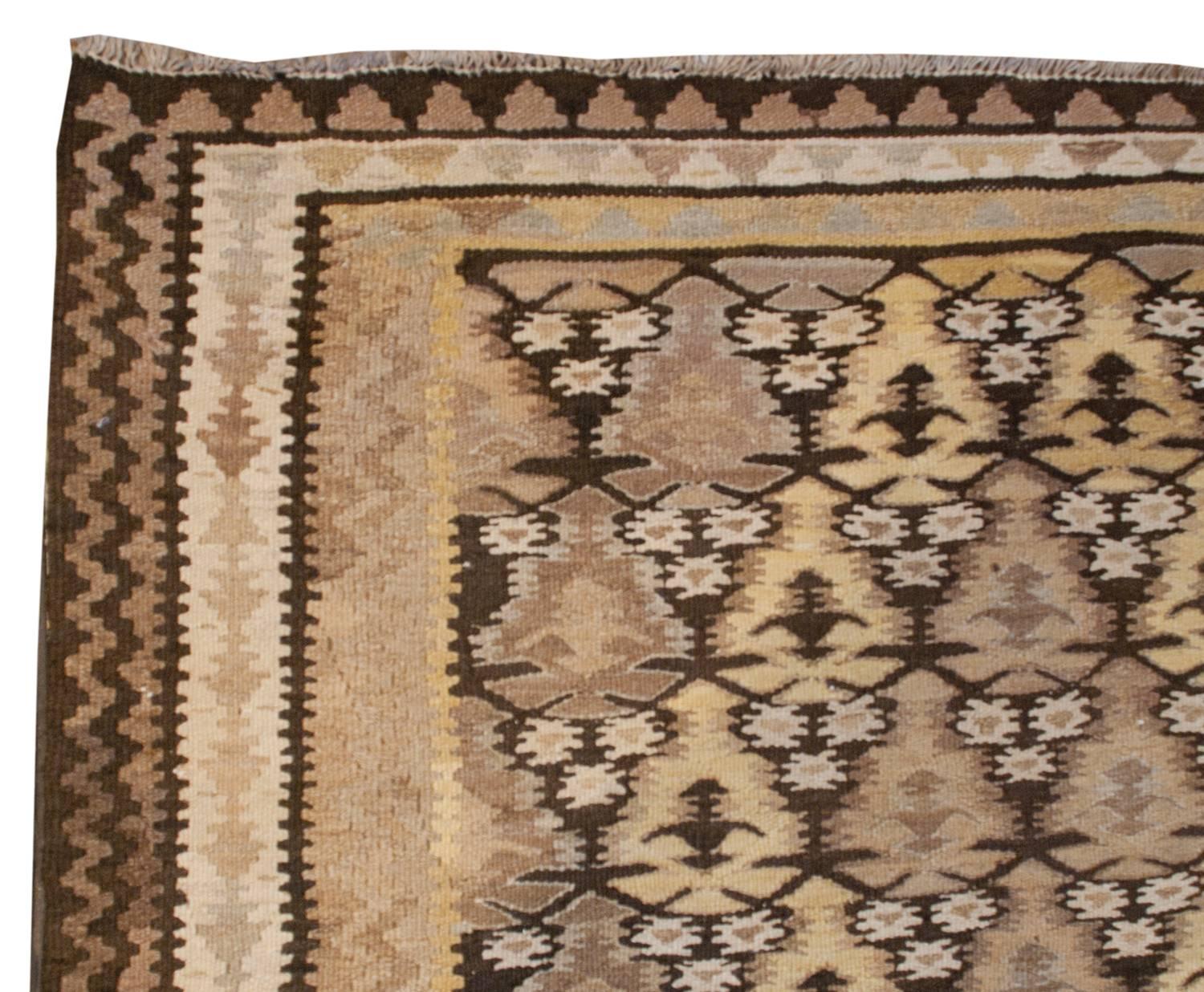 An early 20th century Persian Qazvin Kilim runner with a beautiful all-over tree-of-life pattern, woven with a subtle diamond pattern.  The border is wide, with three distinct geometric patterns.  