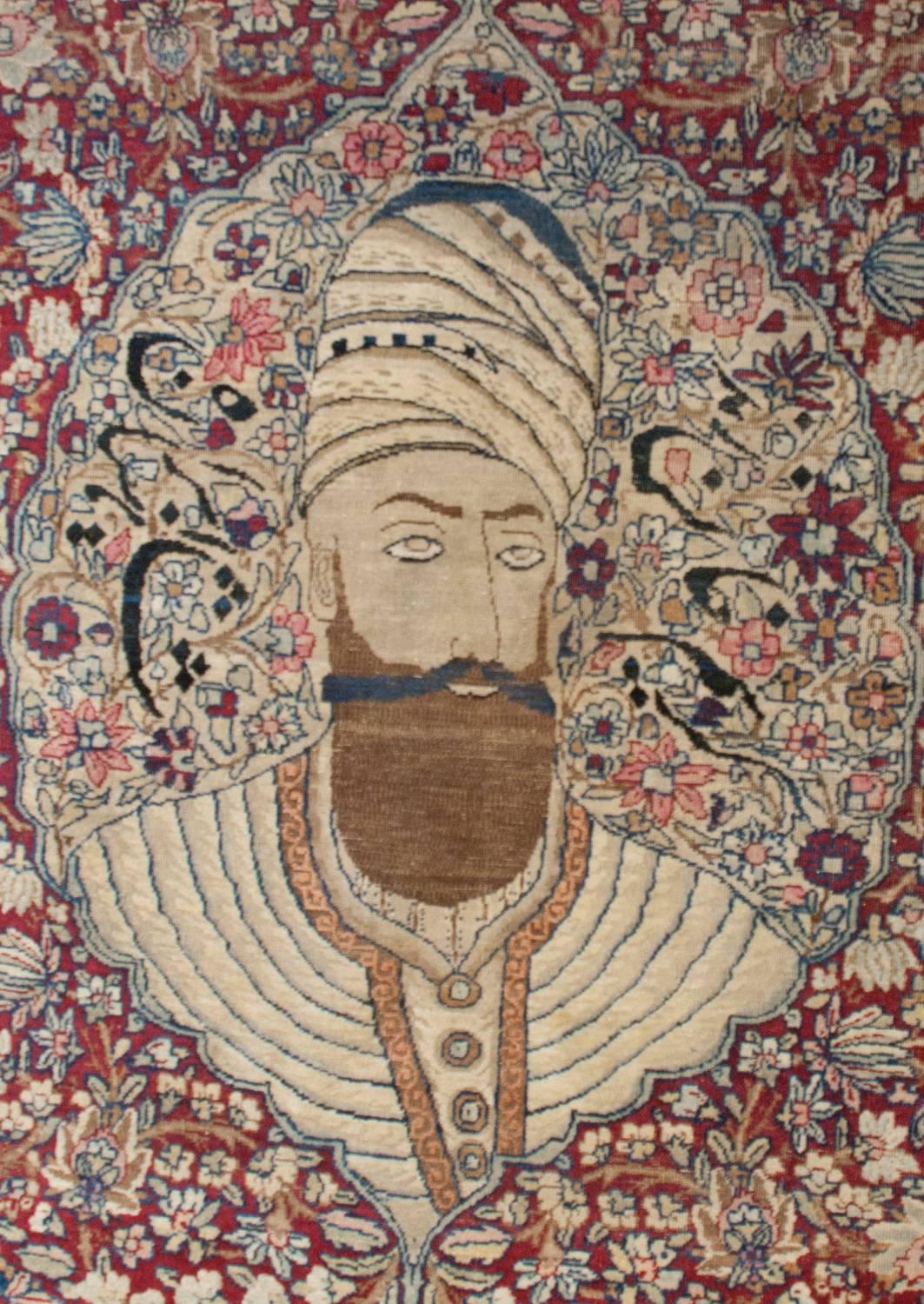 An outstanding notable 19th century Persian Kirman rug with a beautifully rendered depiction of the 18th century founder of the Zandieh Dynasty, Karim Khan in the center woven amidst a wonderful field of flowers. The portrait floats above a